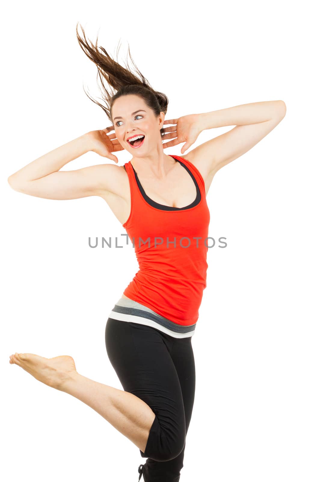 A happy, beautiful fit woman doing aerobics. Isolated over white.