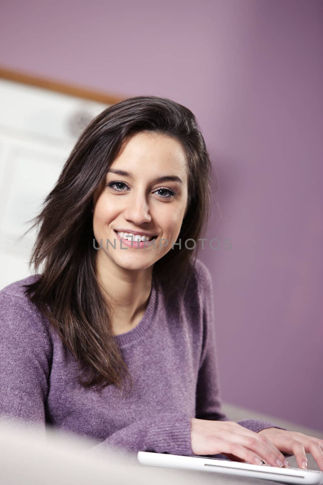 portrait of young woman using laptop