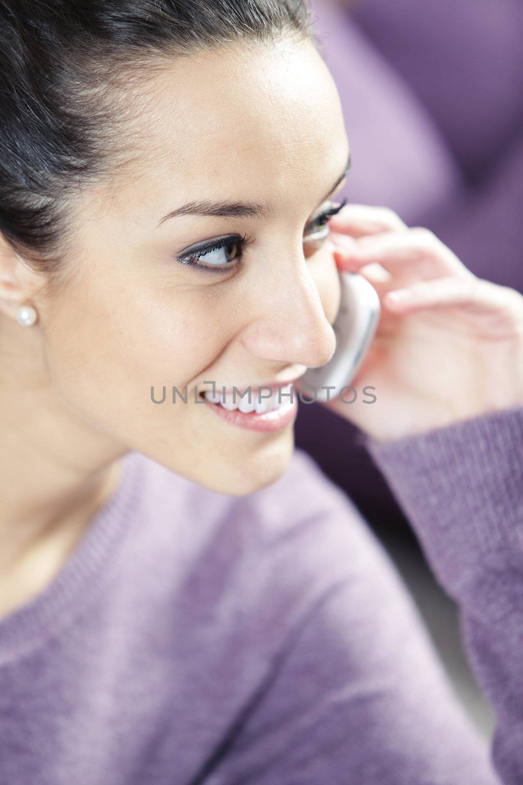 young smiling woman on phone