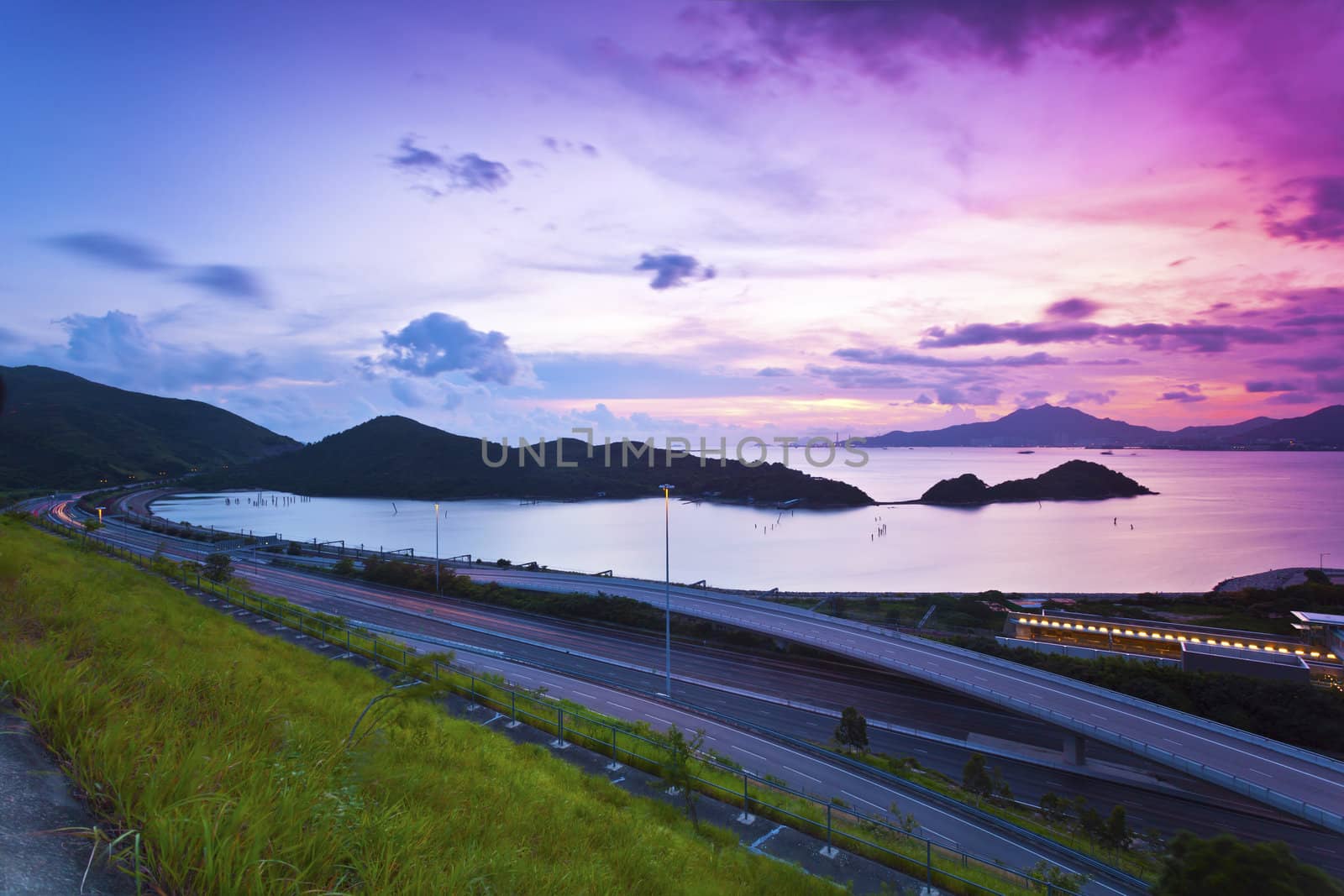 Traffic highway in Hong Kong at sunset by kawing921