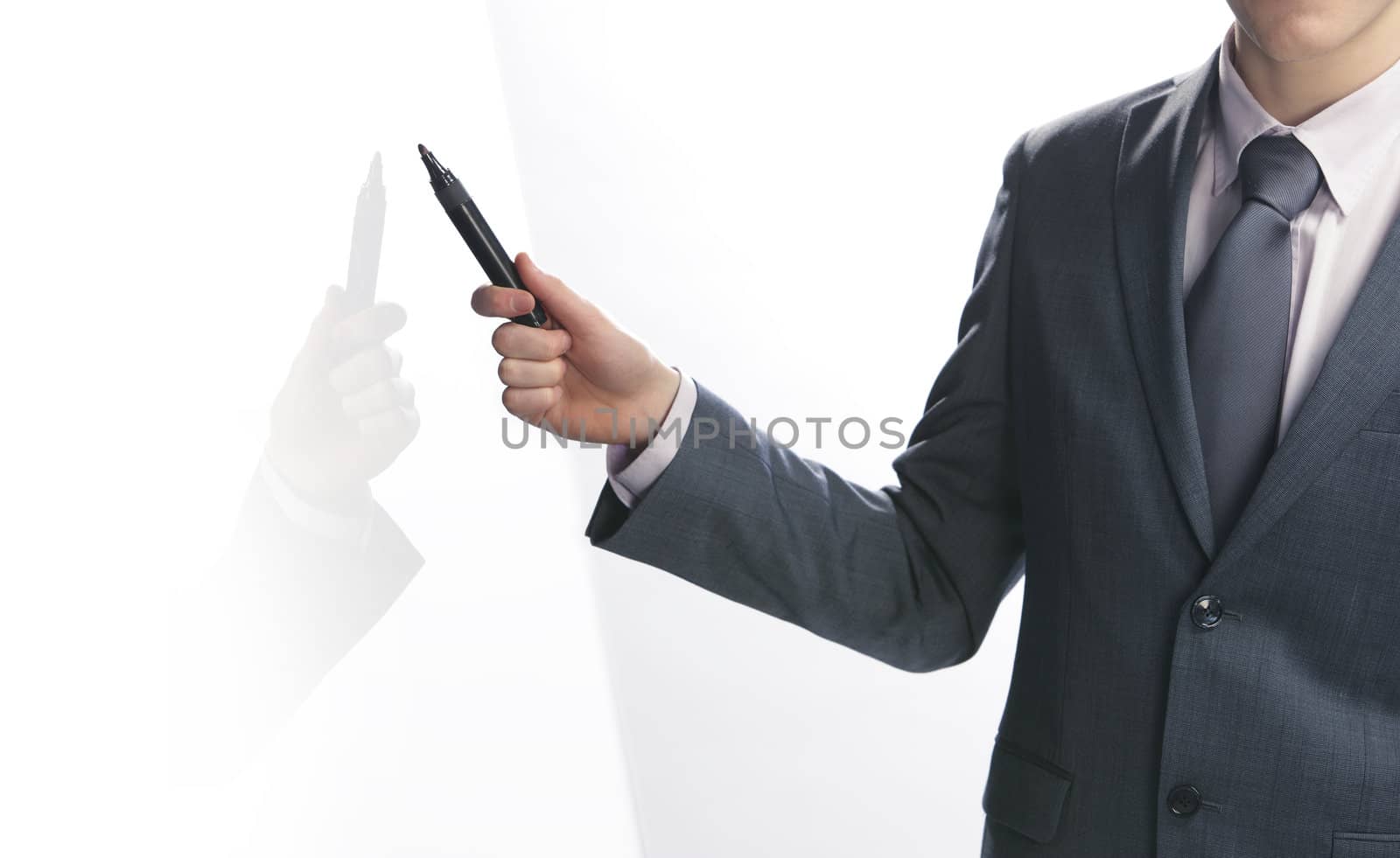 Businessman pointing with a pen by stokkete
