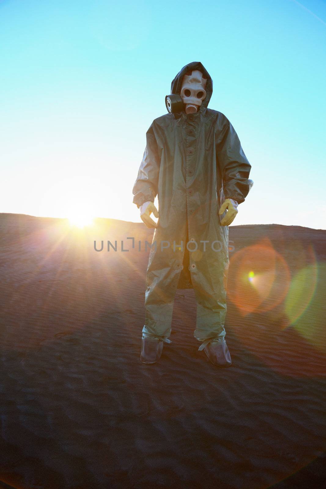 Man in protective suit and rays of sun by pzaxe