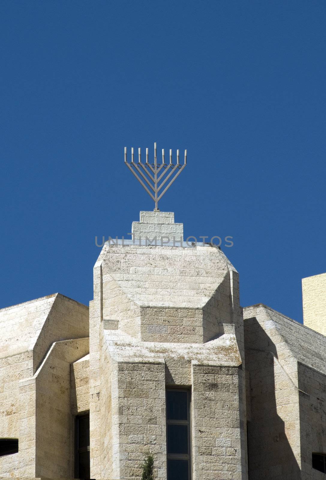 Menorra in the centre of jerusalem on a building near the mosk