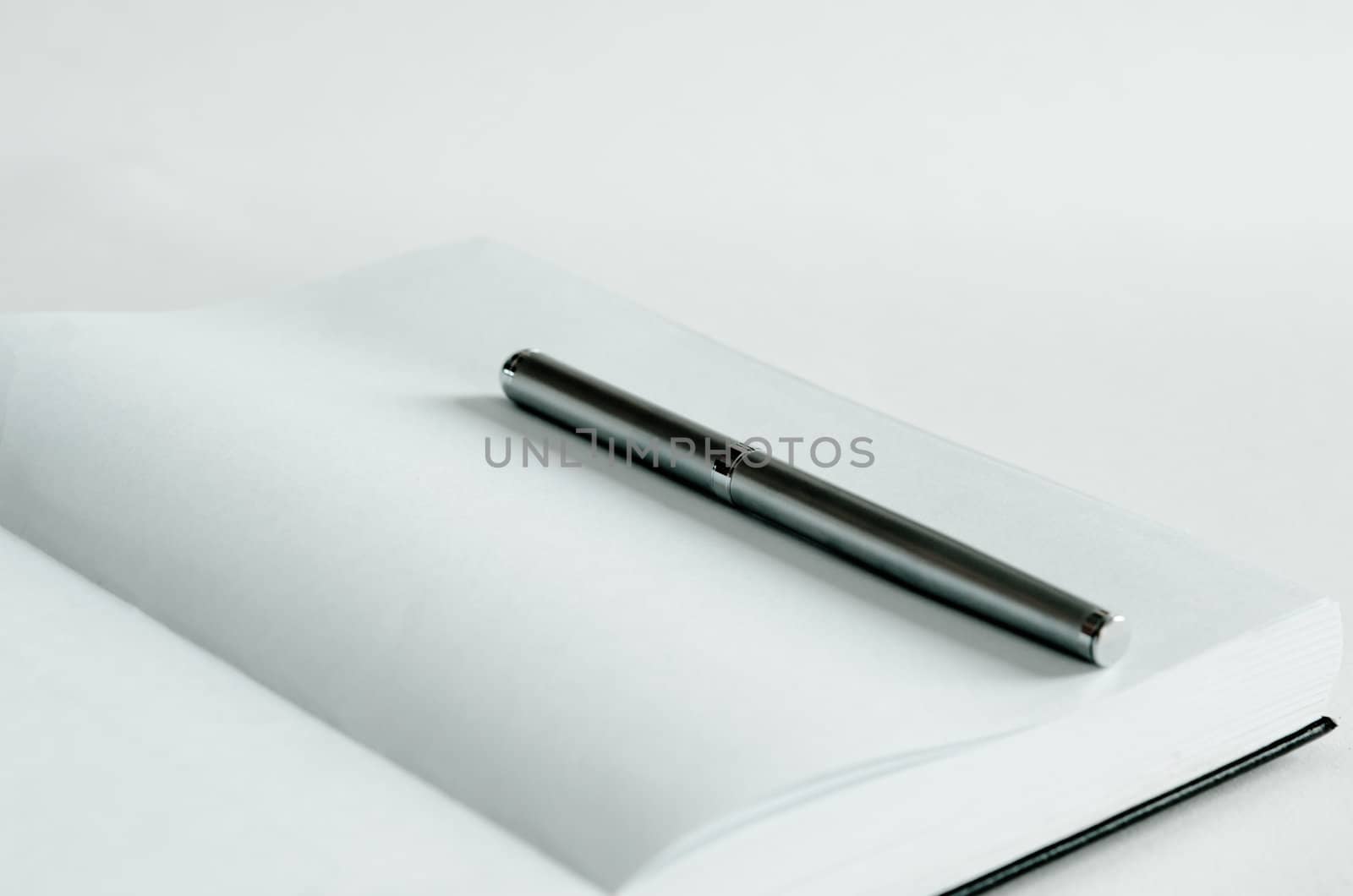 Open note book and pen for records .
