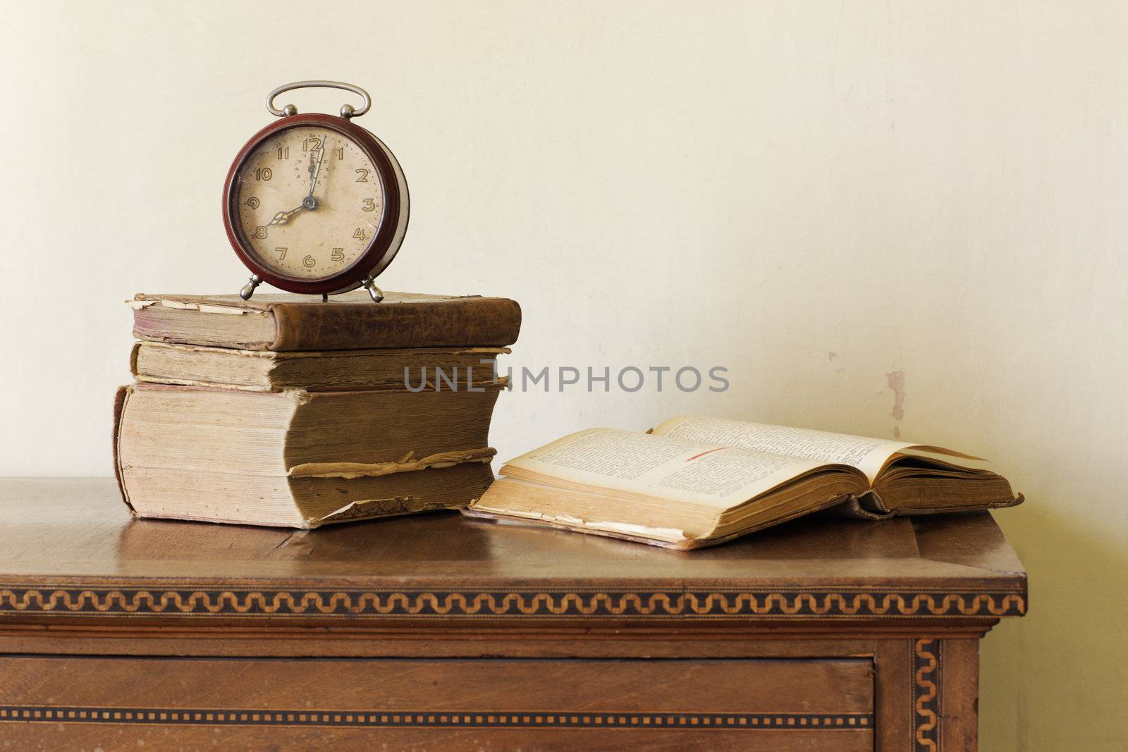 old alarm clock on old books, copy space