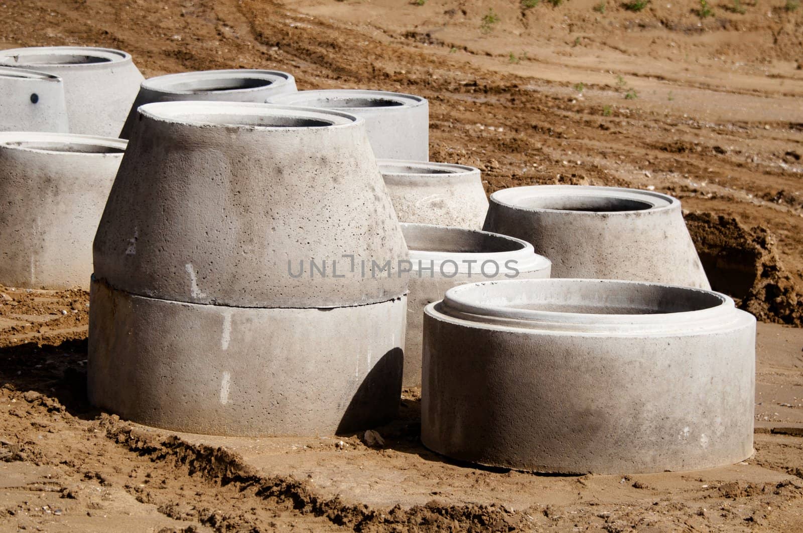 concrete drainage pipes on a construction site for a highway extension