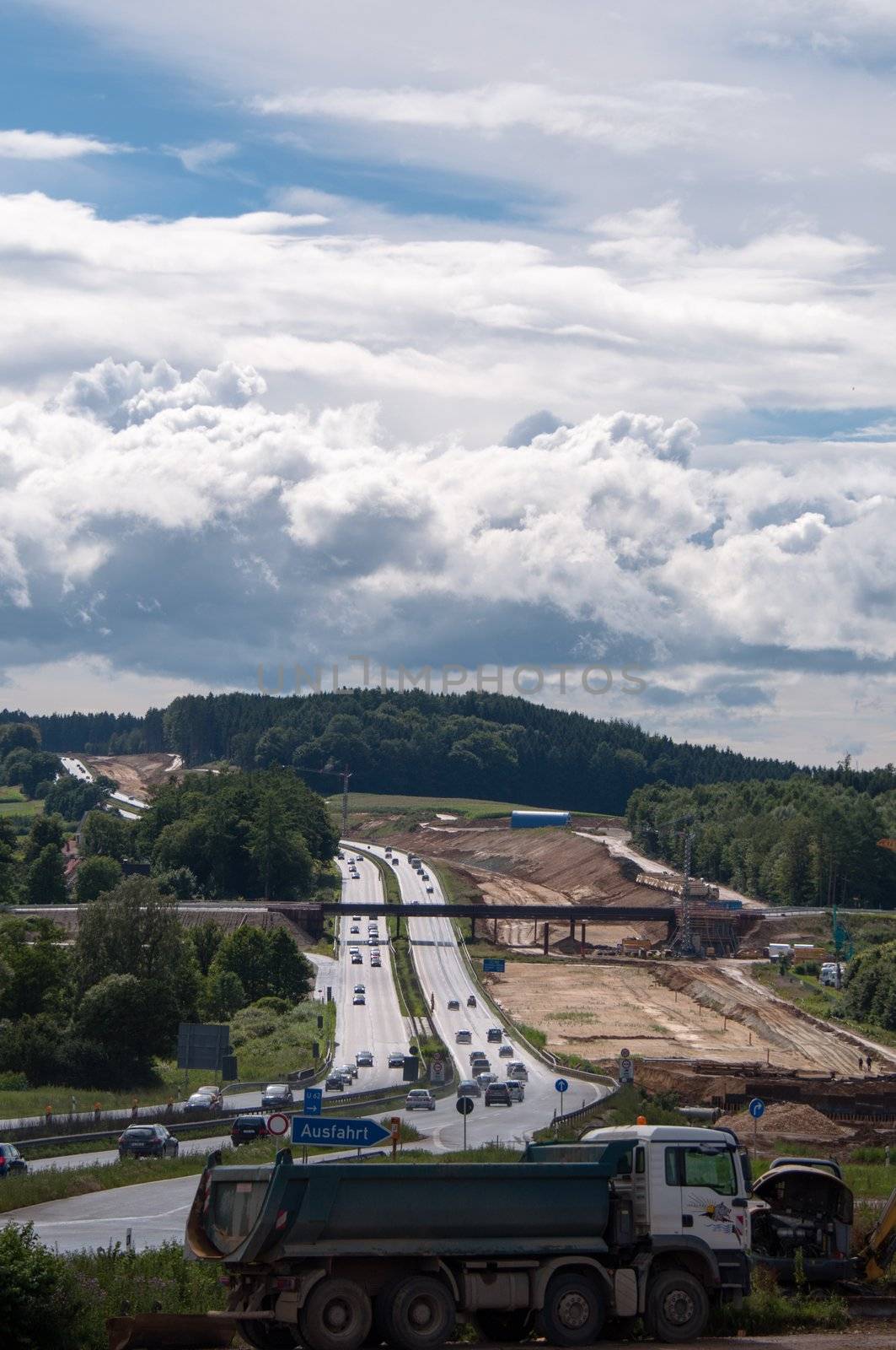 ZUSMARSHAUSEN, GERMANY – JULY 15: Construction site of the extension of A8 highway from currently 4 to 6 lanes at Zusmarshausen, Germany on July 15, 2012. Heavy machinery is used for this massive project happening in a timeframe of over 2 years.