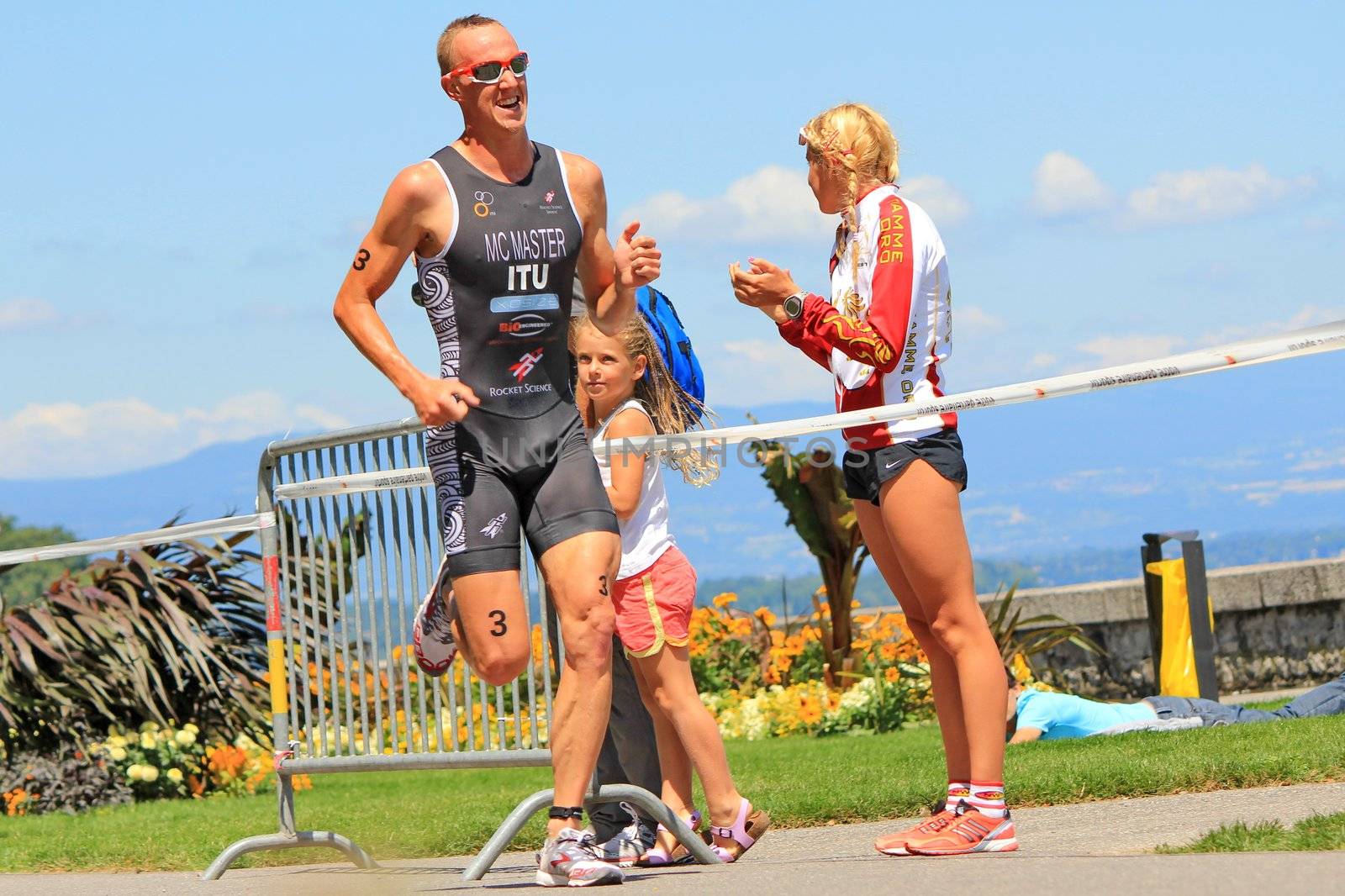 GENEVA, SWITZERLAND - JULY 22 : one athlete running  at the international Geneva Triathlon, on july 22, 2012 in Geneva, 