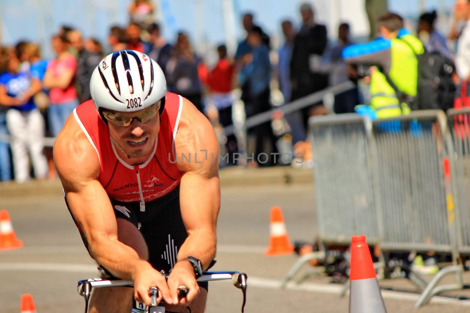 GENEVA, SWITZERLAND - JULY 22 : one unidentified male racing cyclist after the swimm race at the international Geneva Triathlon, on july 22, 2012 in Geneva, 