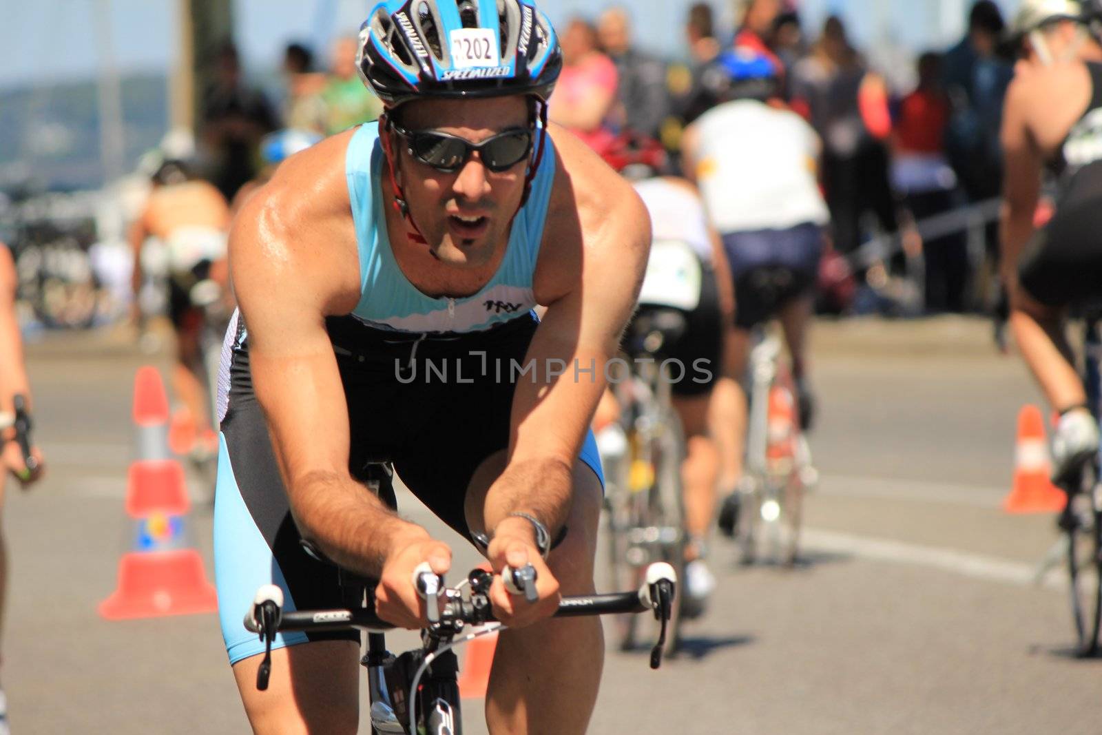 GENEVA, SWITZERLAND - JULY 22 : one unidentified male racing cyclist after the swimm race at the international Geneva Triathlon, on july 22, 2012 in Geneva, 