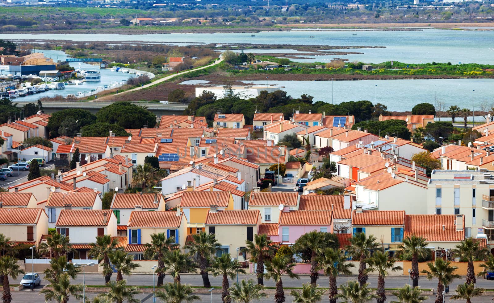View of the gated community on the shore of the sea by Discovod
