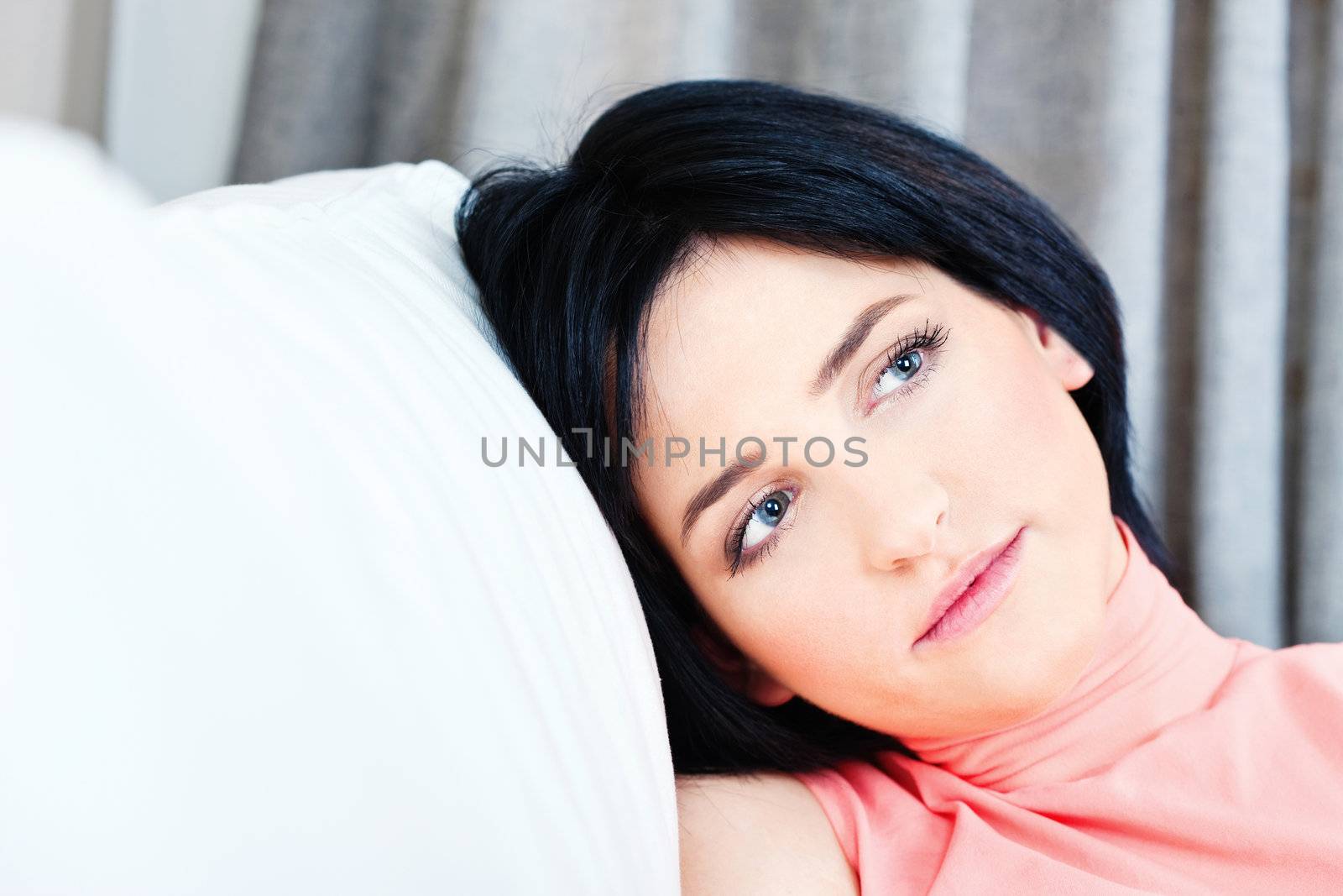 Pretty black hair woman on white sofa at home