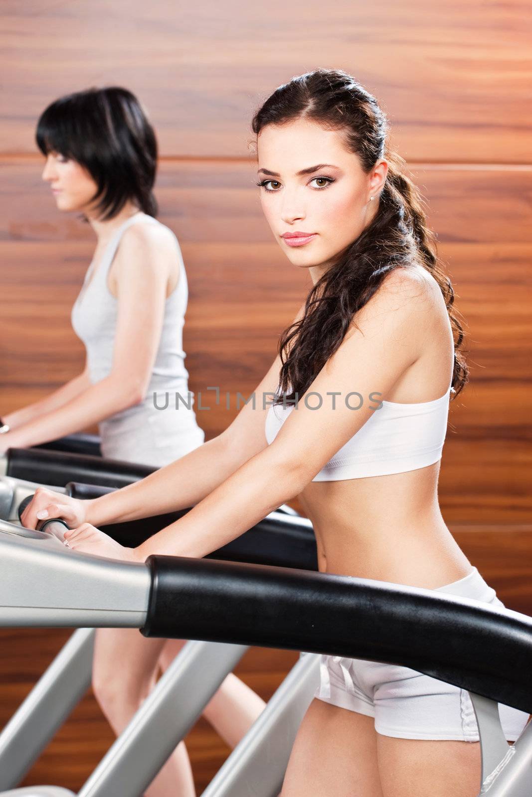 Women doing exercise in gym center