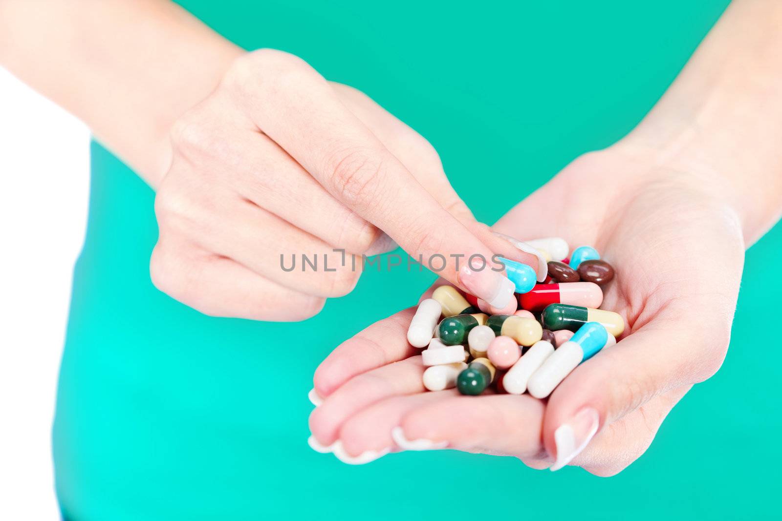capsules in woman's hand, isolated on white