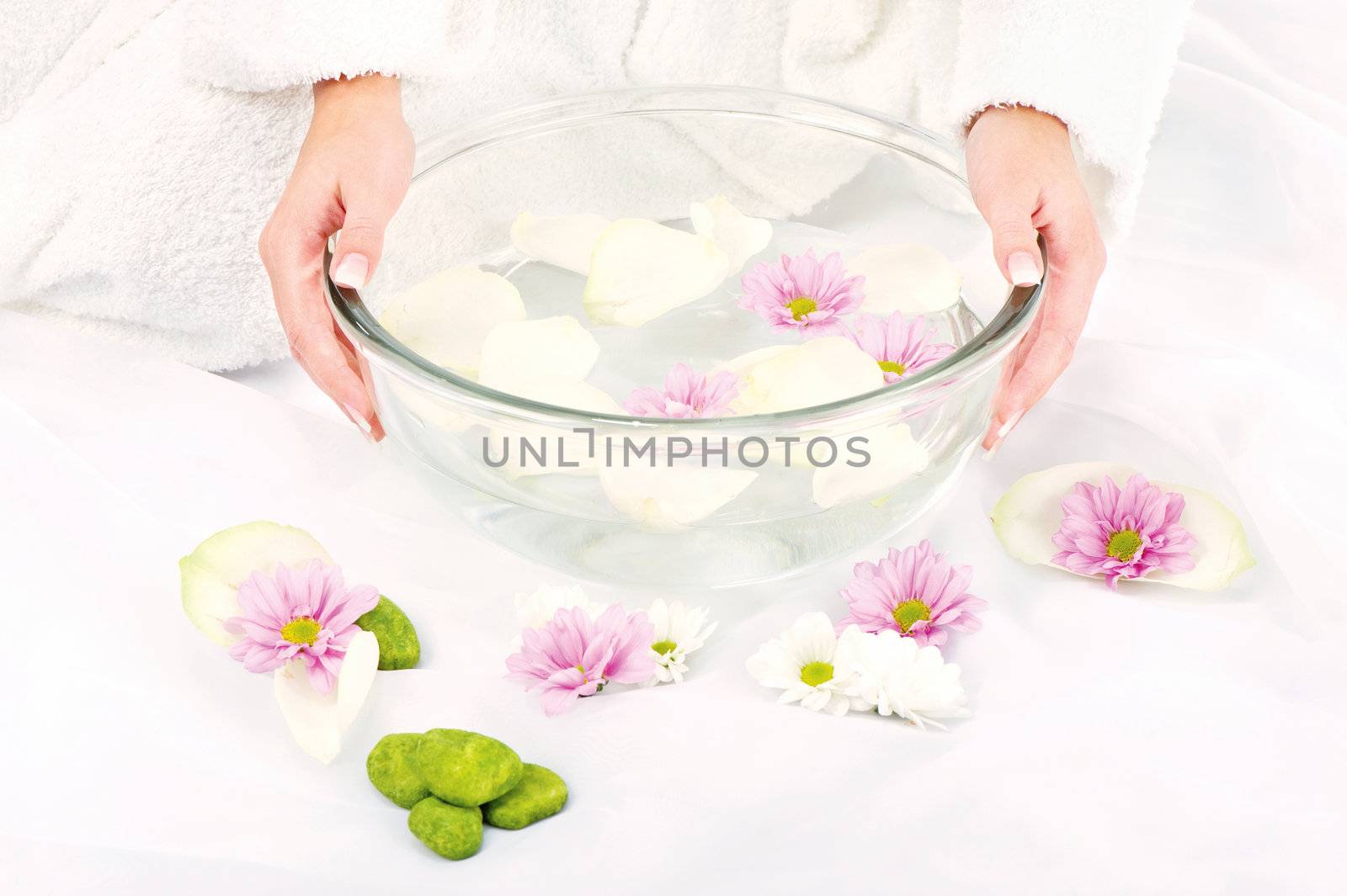 Woman's hands and petal bath