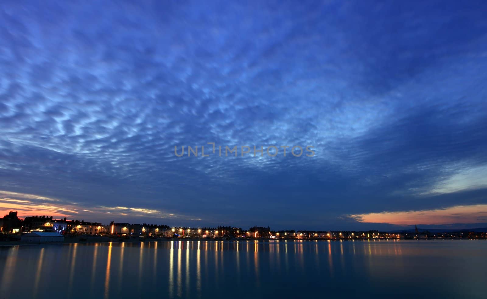 Mackrel sky over Weymouth seafront at dusk in dorset england