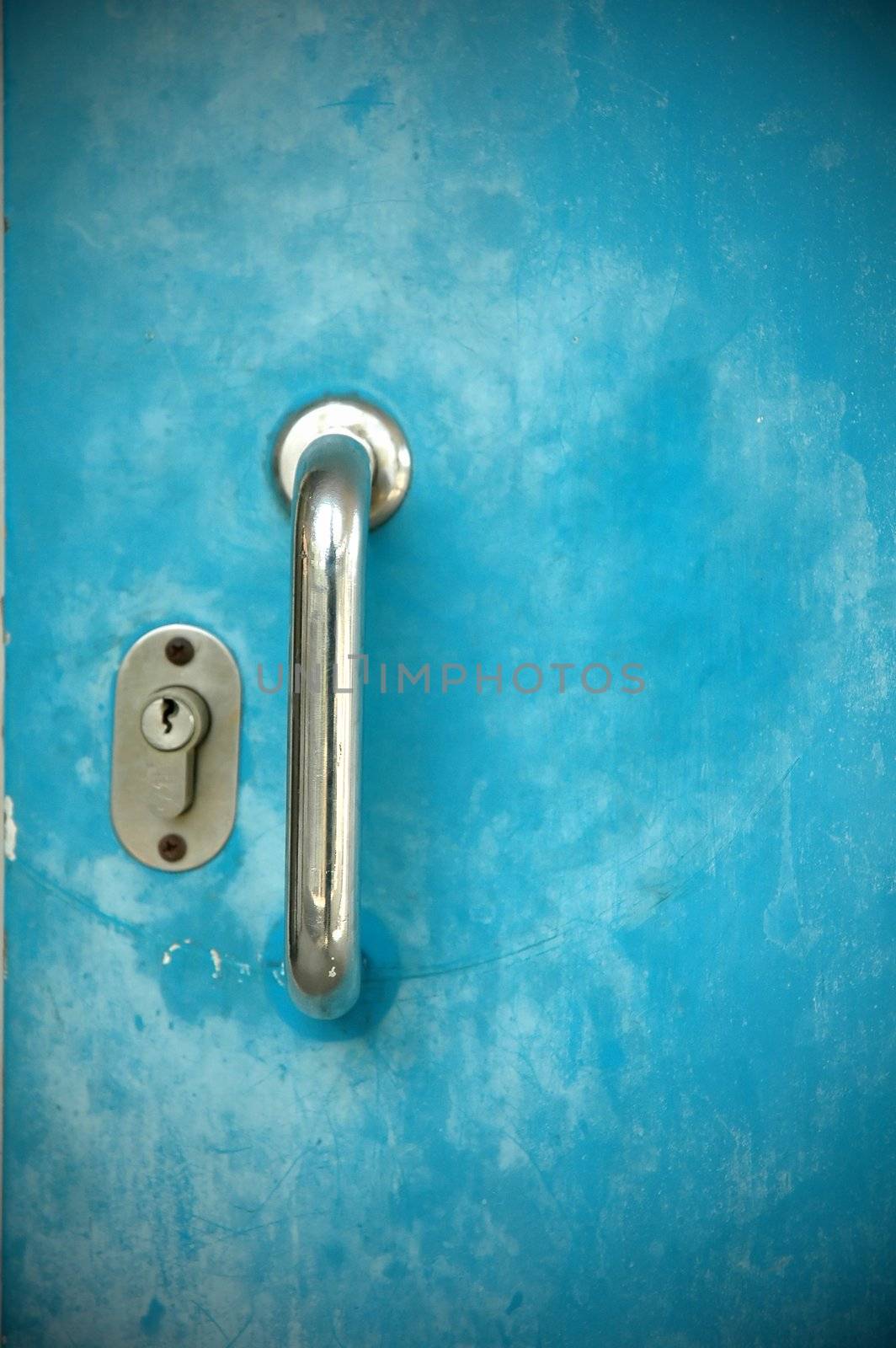 Door handles with  blue metal door 
