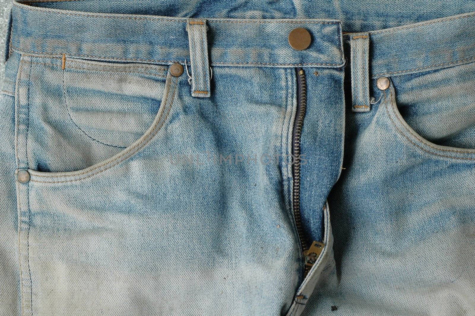 Closeup of blue denim jeans pockets. 