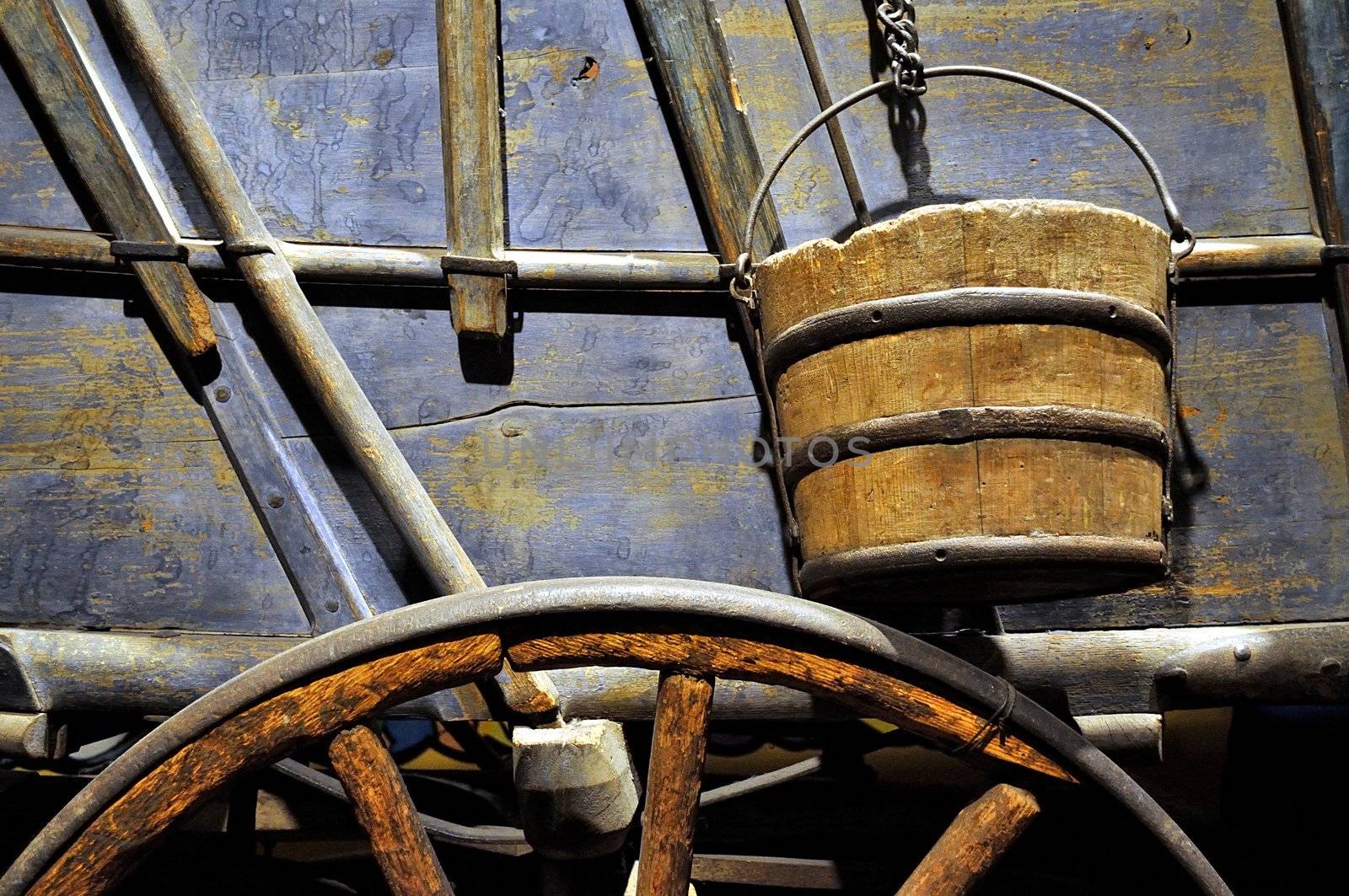Closeup of an old wagon with water bucket