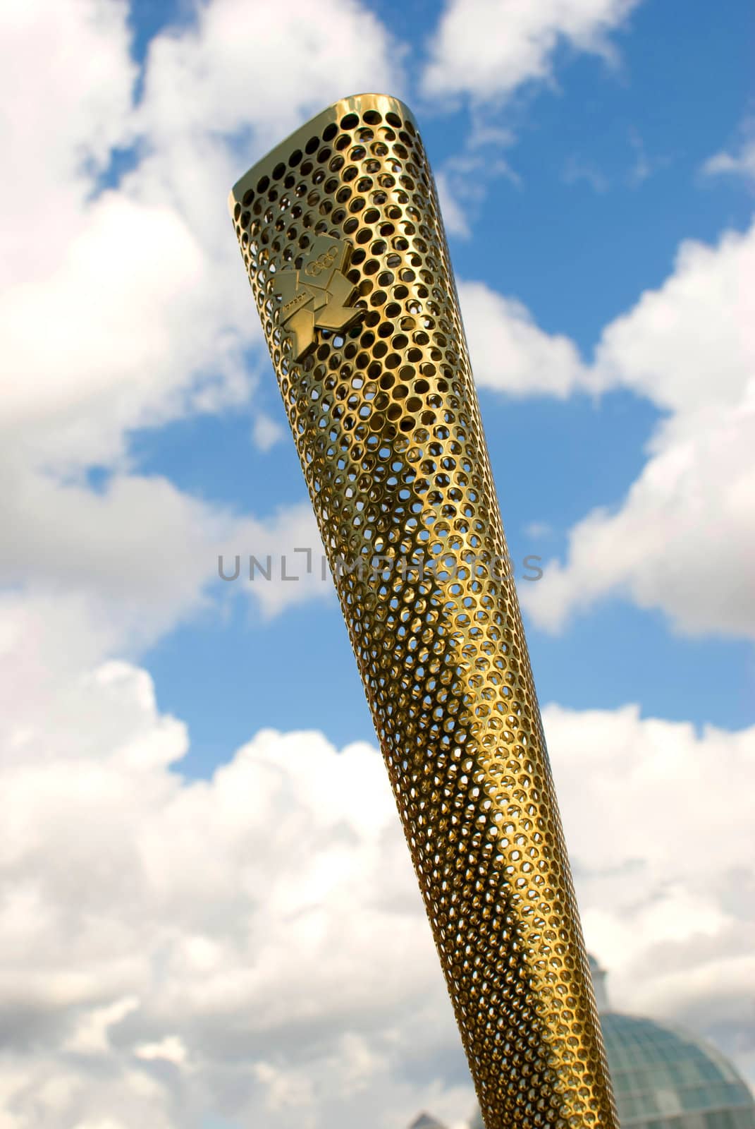 LONDON, UNITED KINGDOM-JULY 21: Olympic games volunteer holding the torch at Greenwich on July 21, 2012 in London, UK. The event is from July 27 to August 12, 2012.