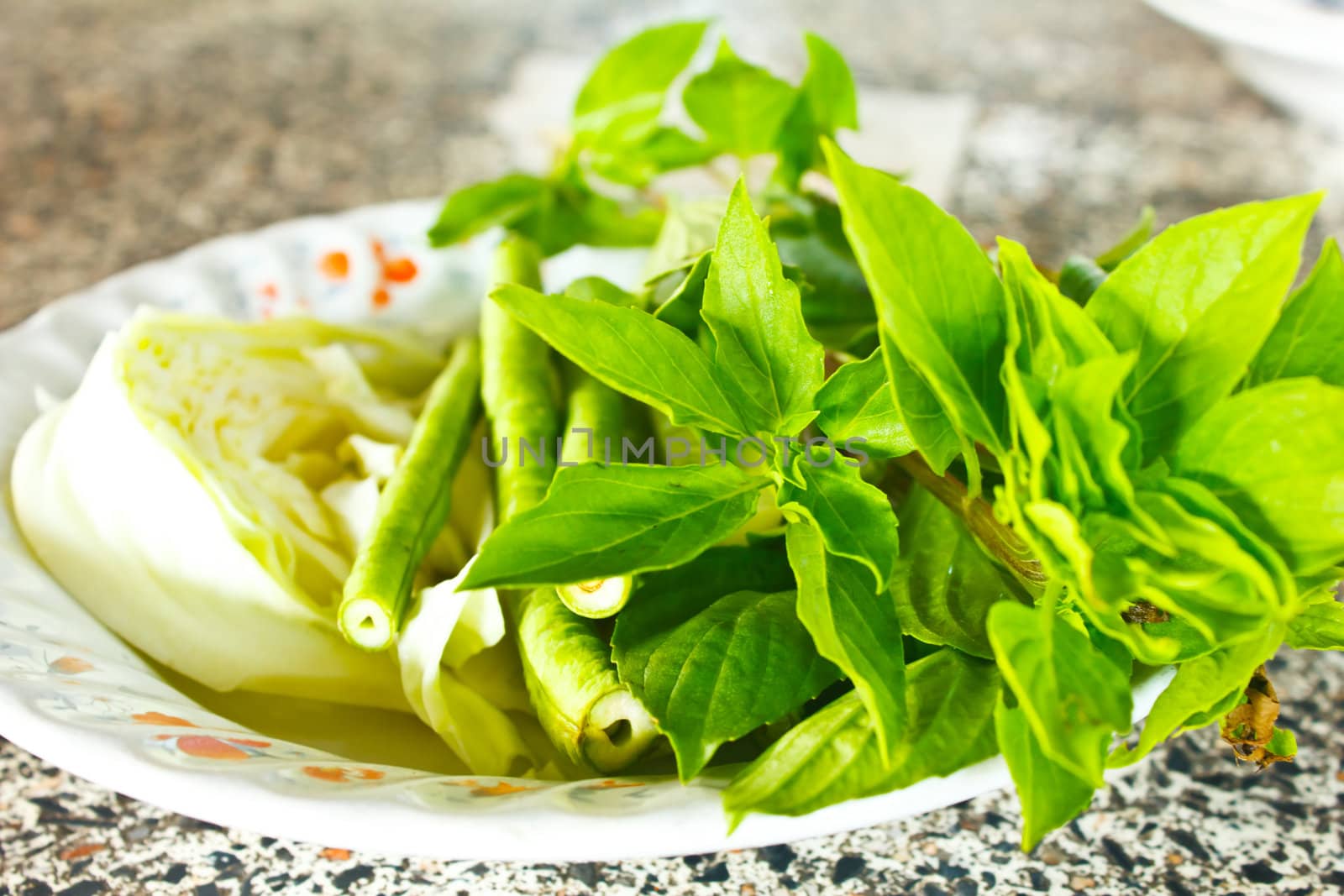 Stock Photo - Green mixed fresh vegetables and thai herb