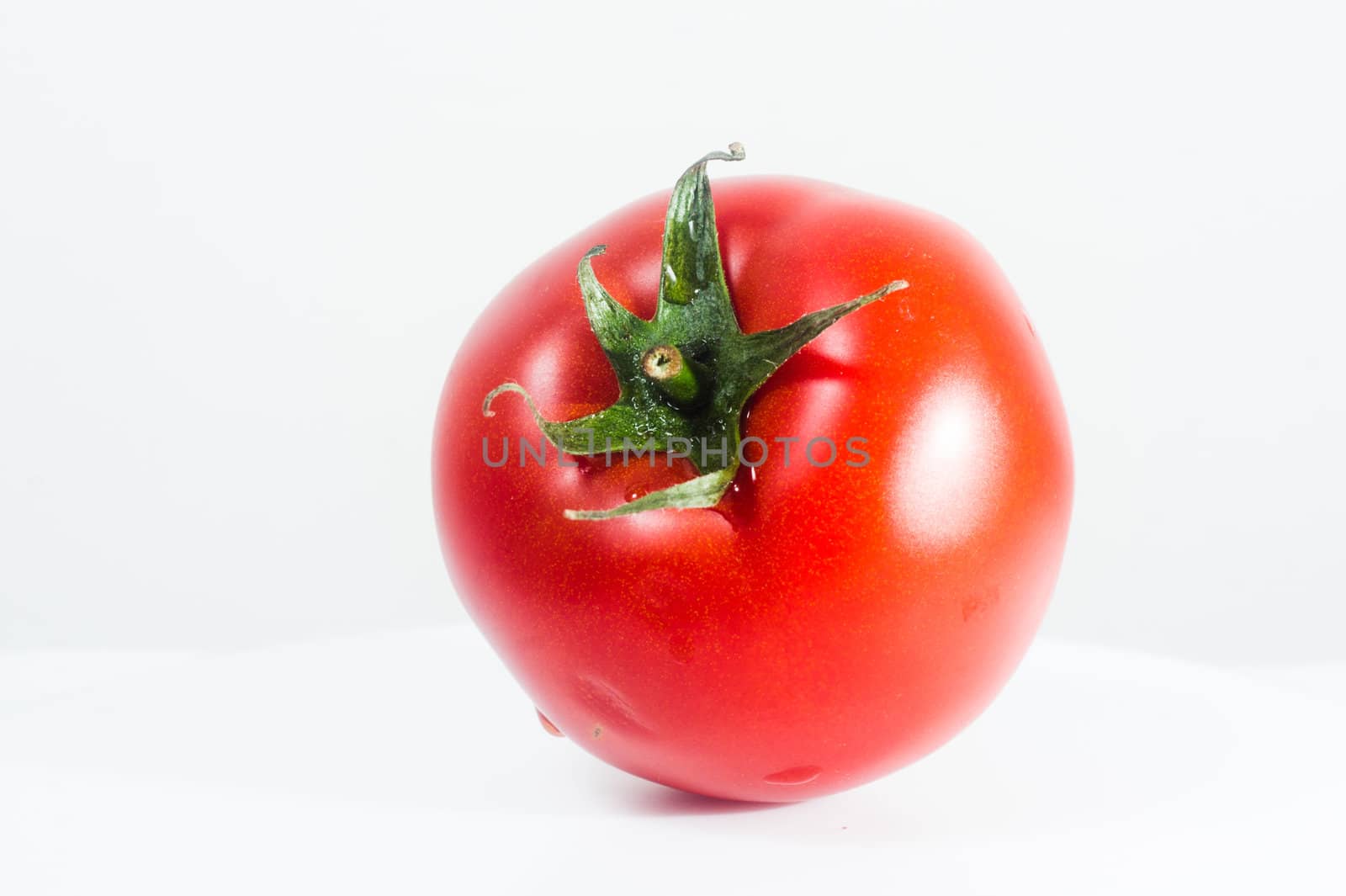 Fresh tomato, isolated on white background