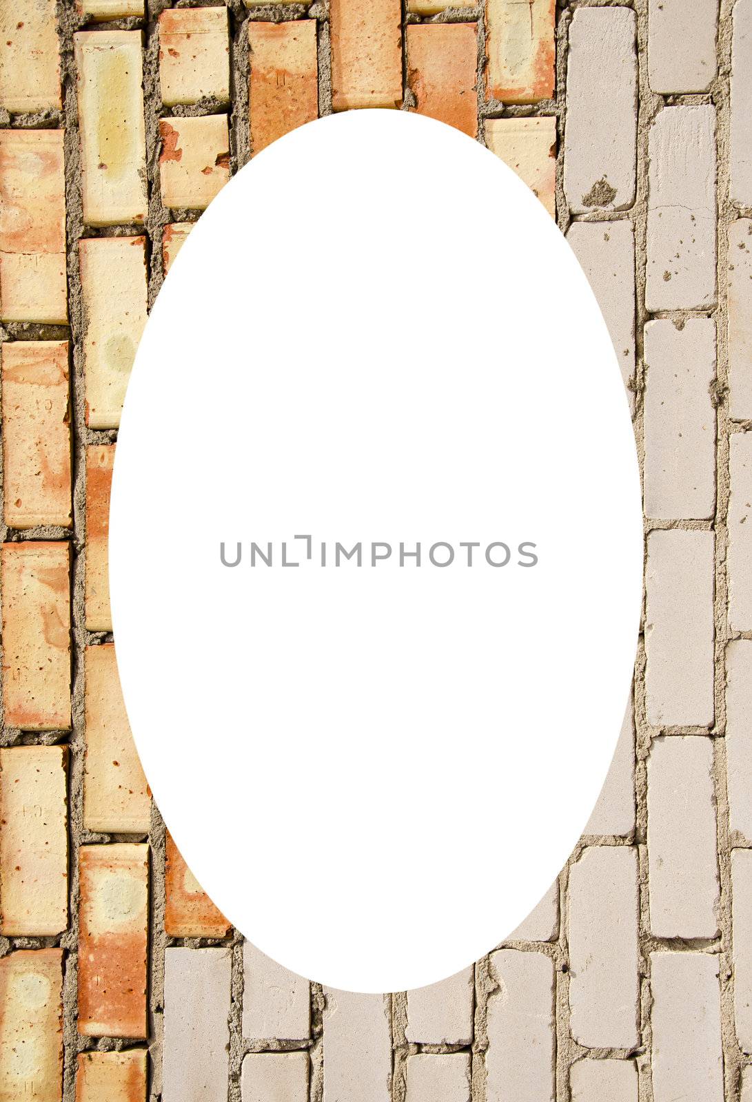 Red and white brick wall and white oval in center by sauletas