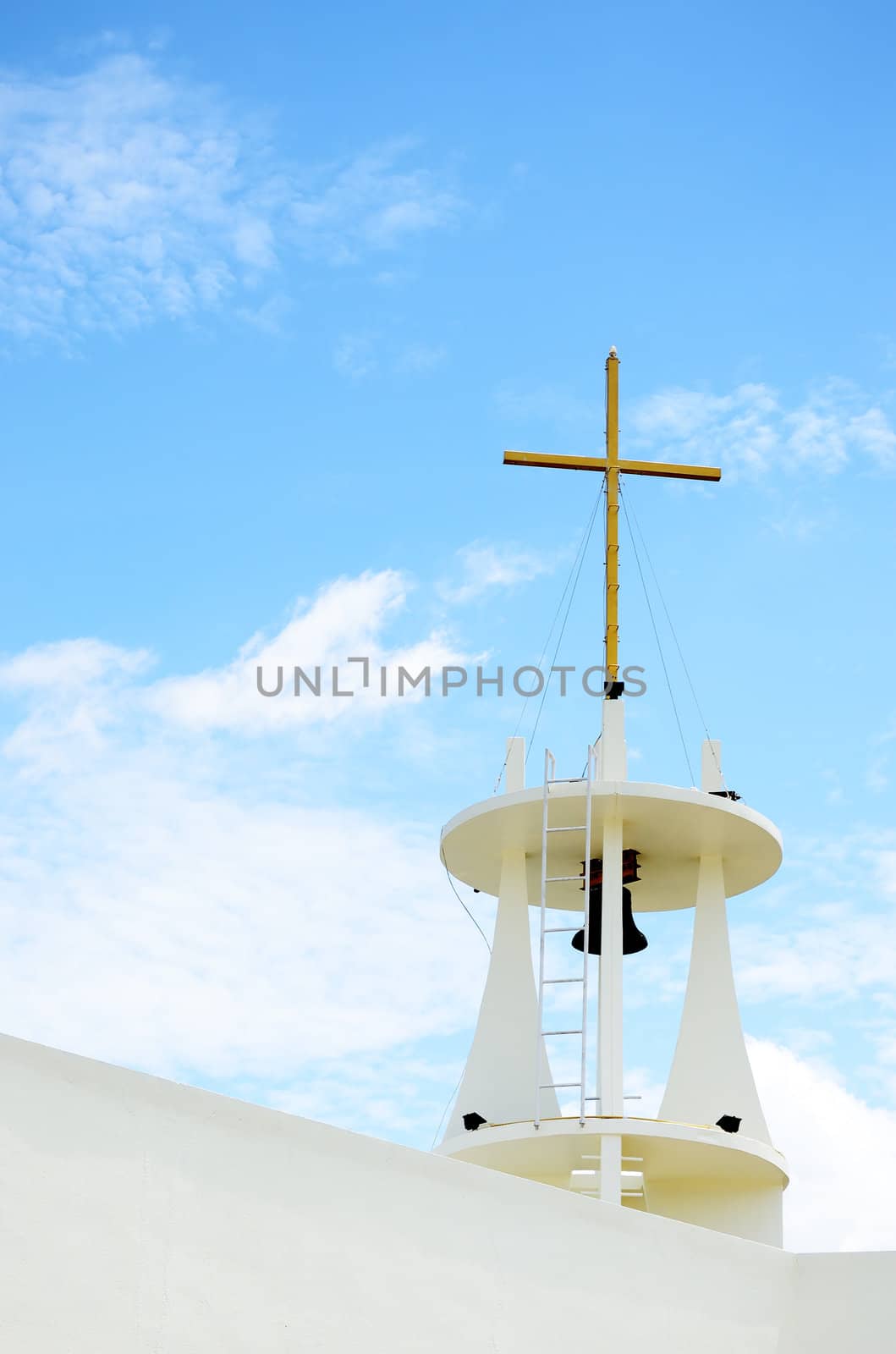 Bell tower with cross at church