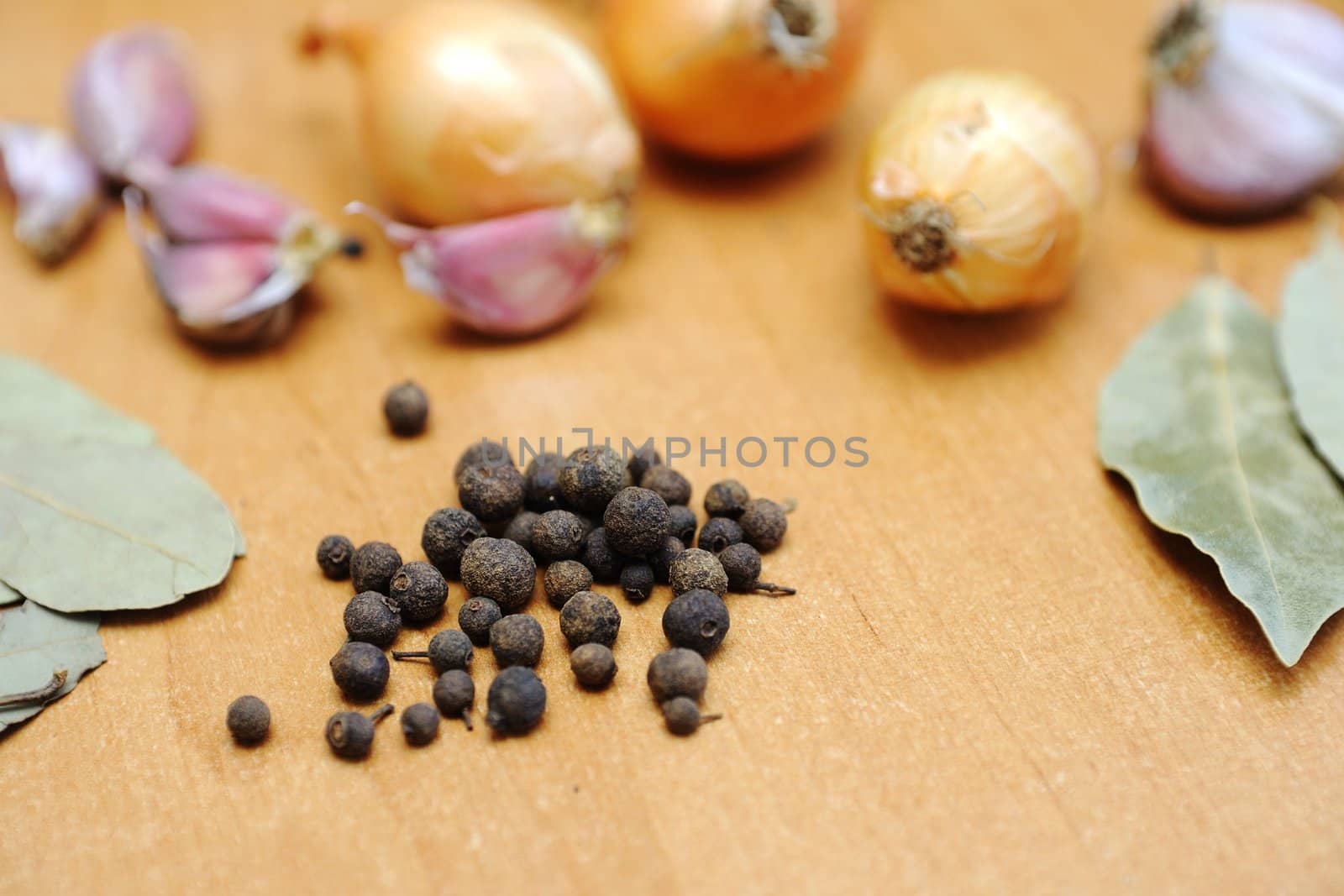 An image of spices on wooden table