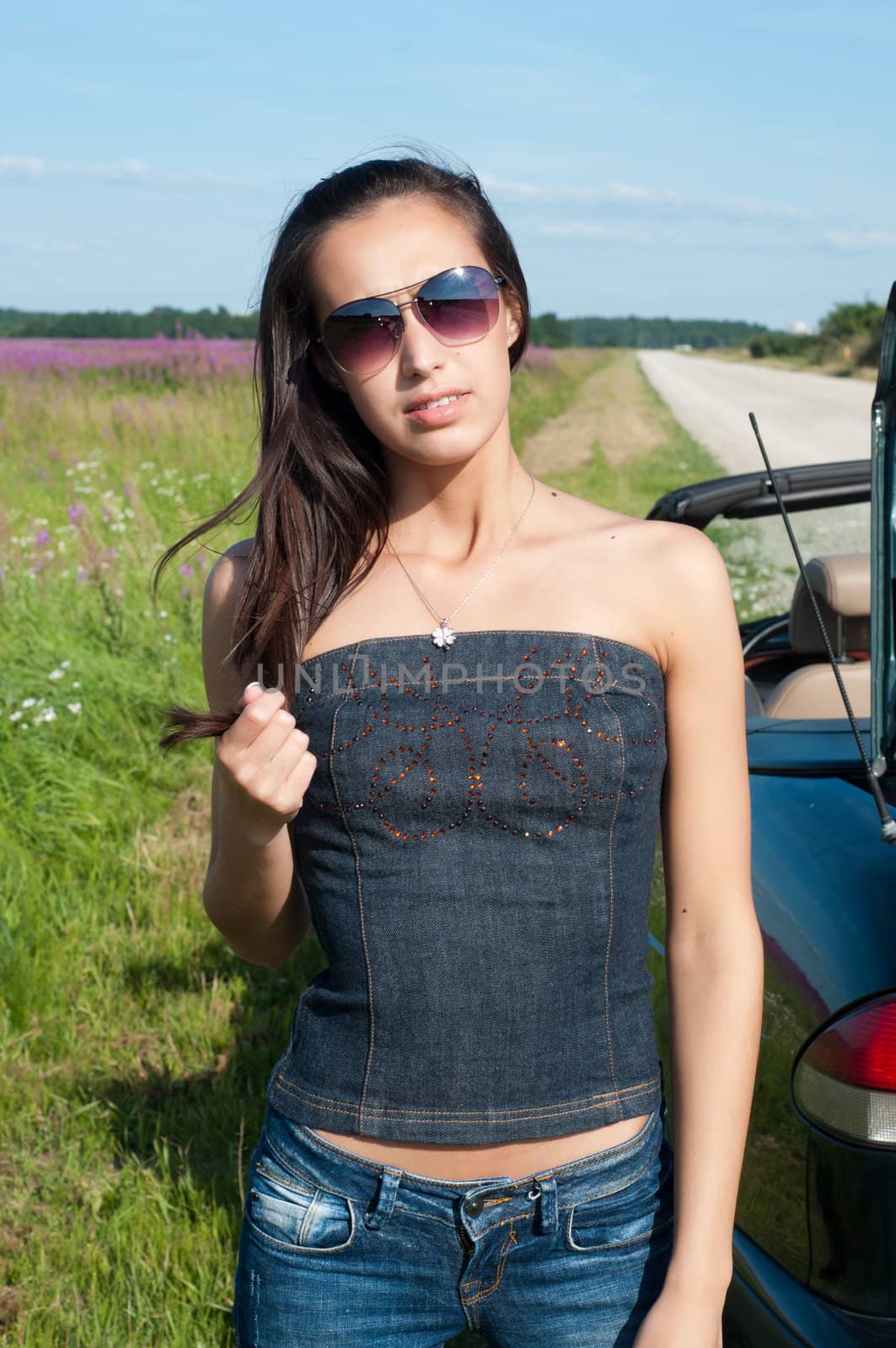 Outdoor shot of beautiful brunette woman with long hair