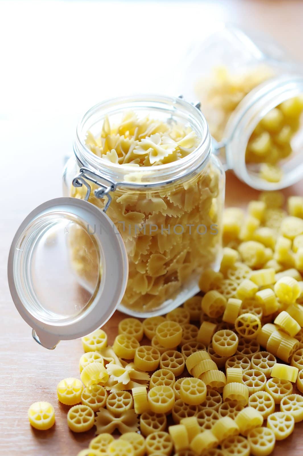 An image of yellow pasta in two jars