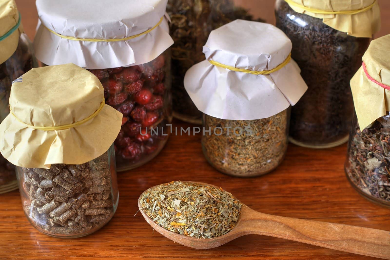An image of tea in a wooden spoon and glasses