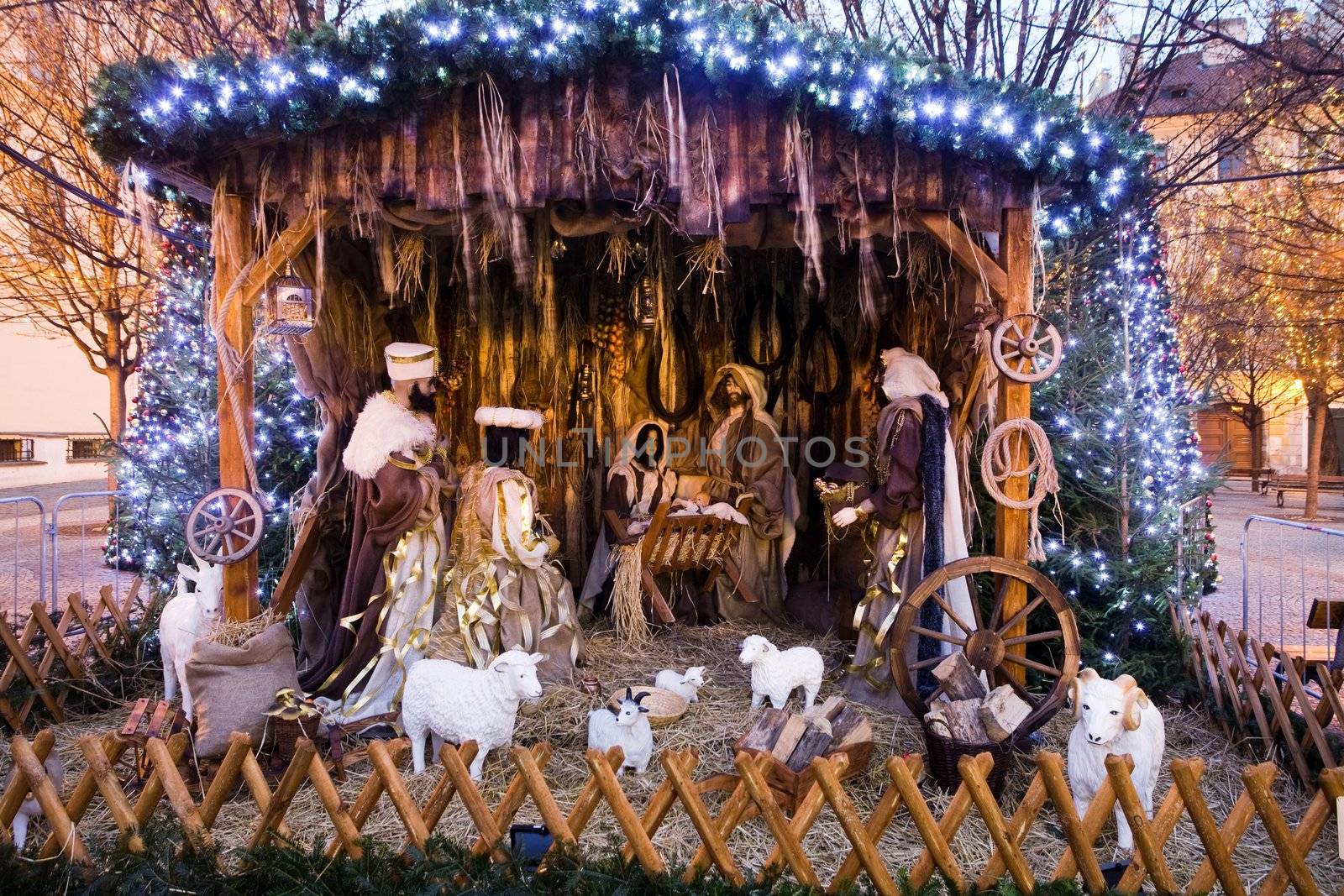 Christmas nativity scene with three Wise Men presenting gifts to baby Jesus