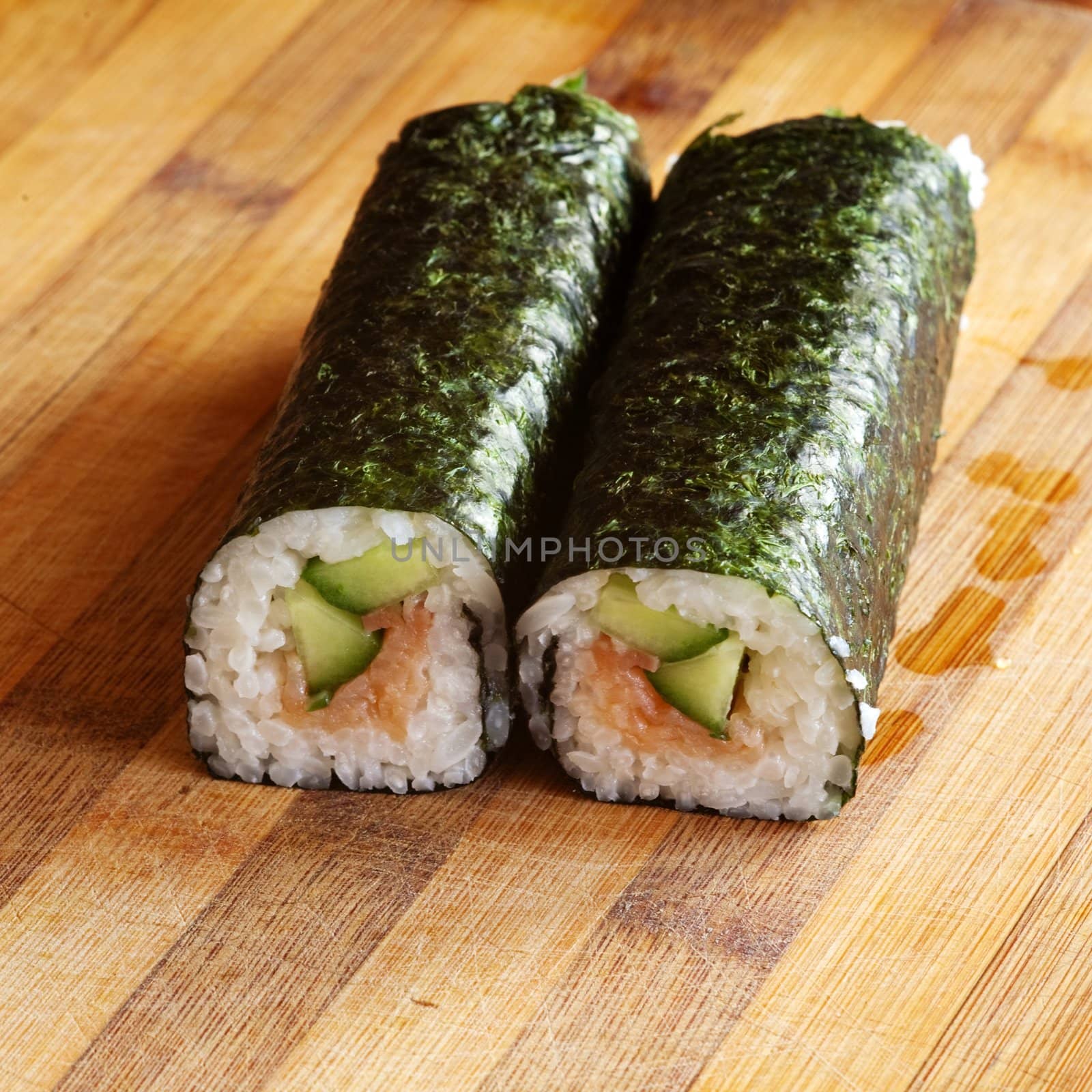 An image of two rolls on wooden plate