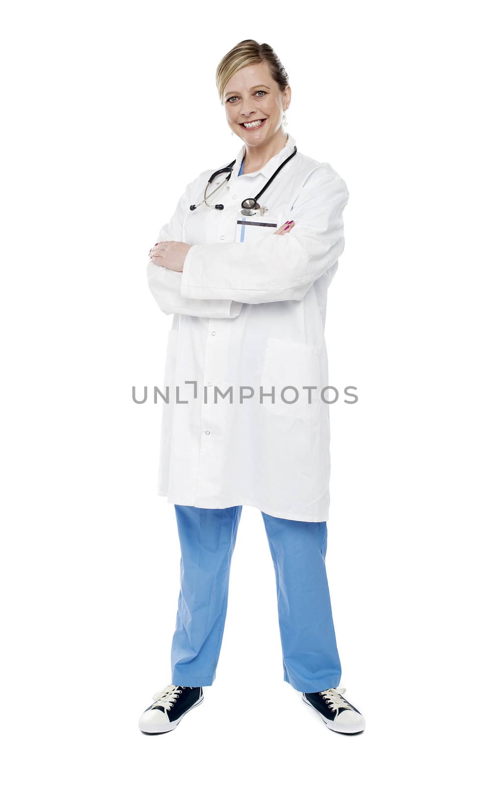 Female physician standing with crossed arms isolated against white background