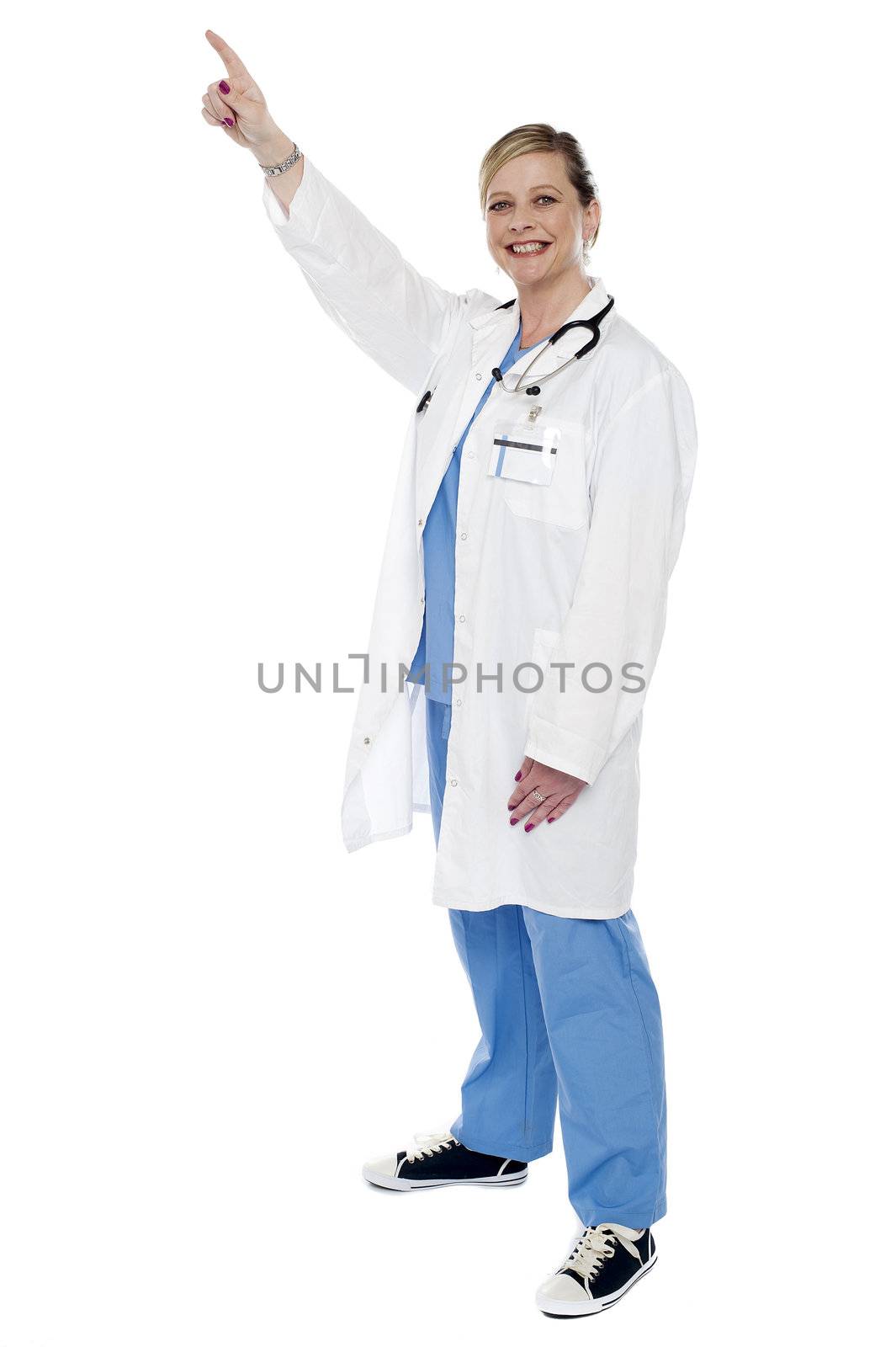 Medical expert pointing finger upwards isolated against white background