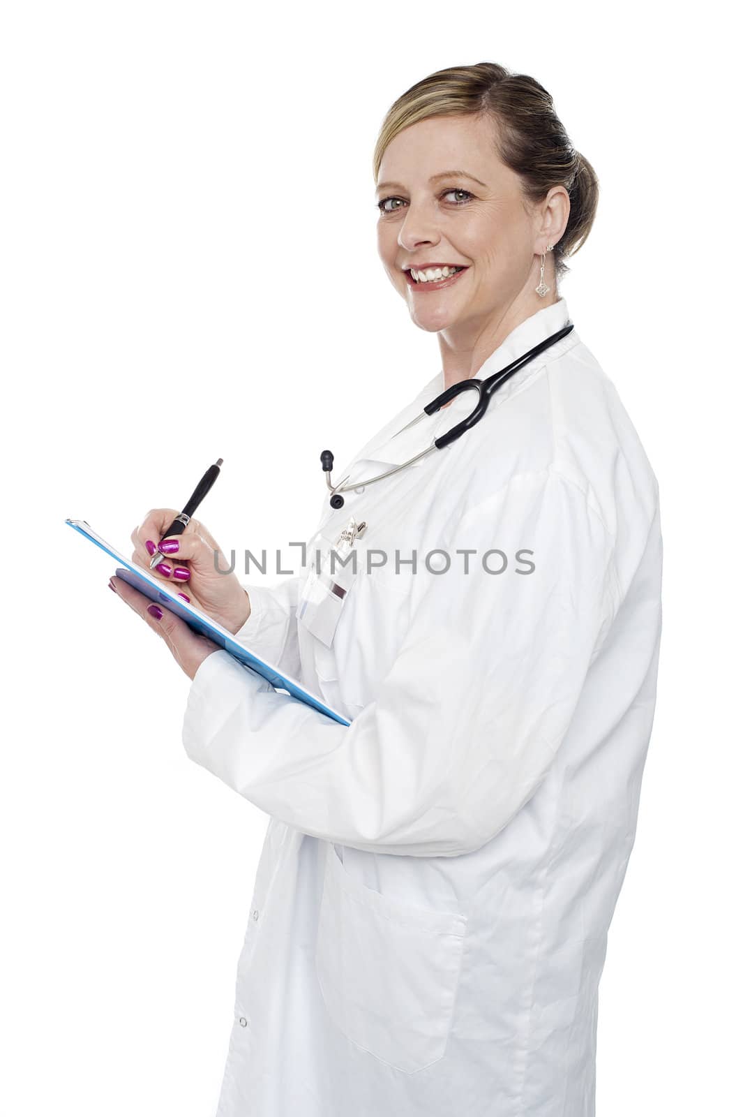 Smiling aged surgeon holding pen and clipboard and looking at camera