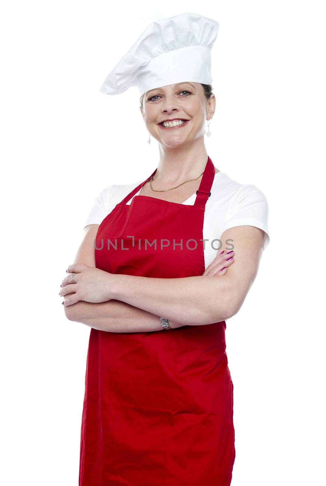 Confident female chef posing with crossed arms isolated on white background