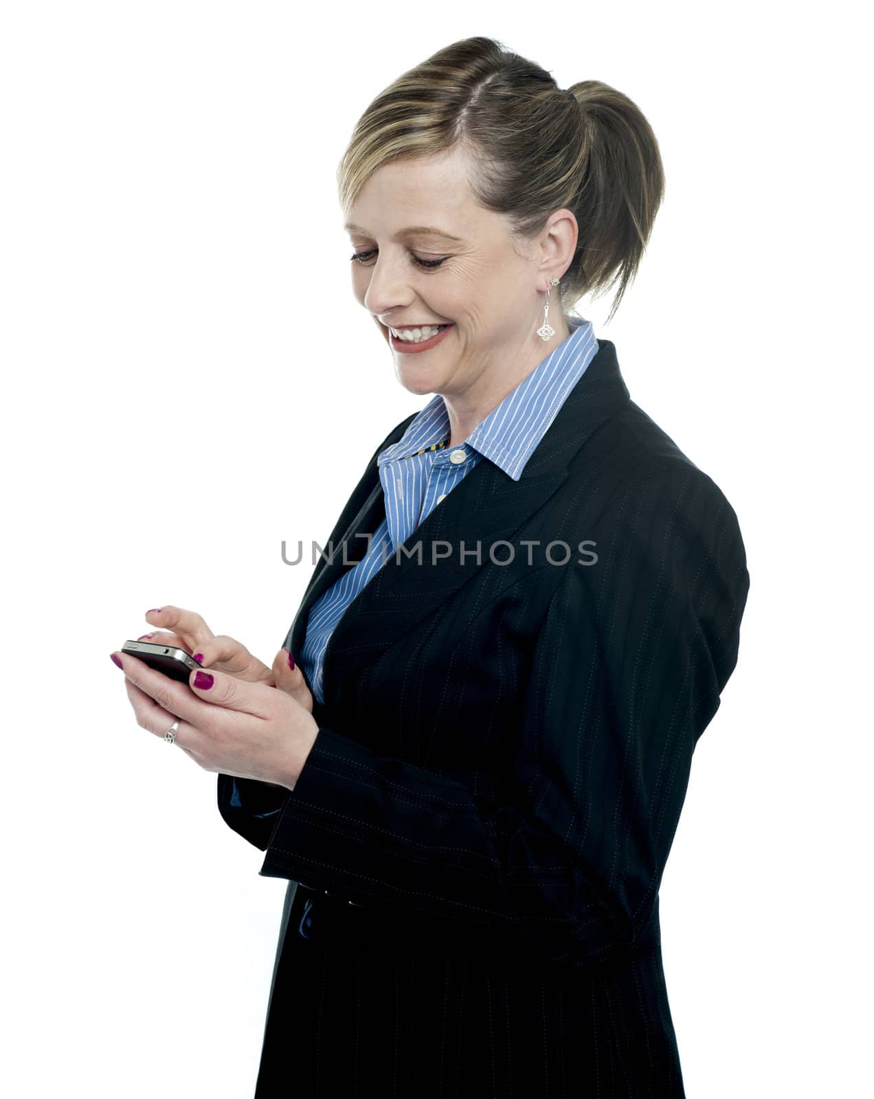 Businesswoman reading message on her mobile and smiling. All on white background