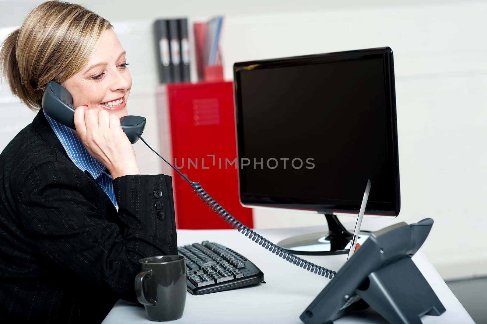 Female secretary answering bosses call and informing updates