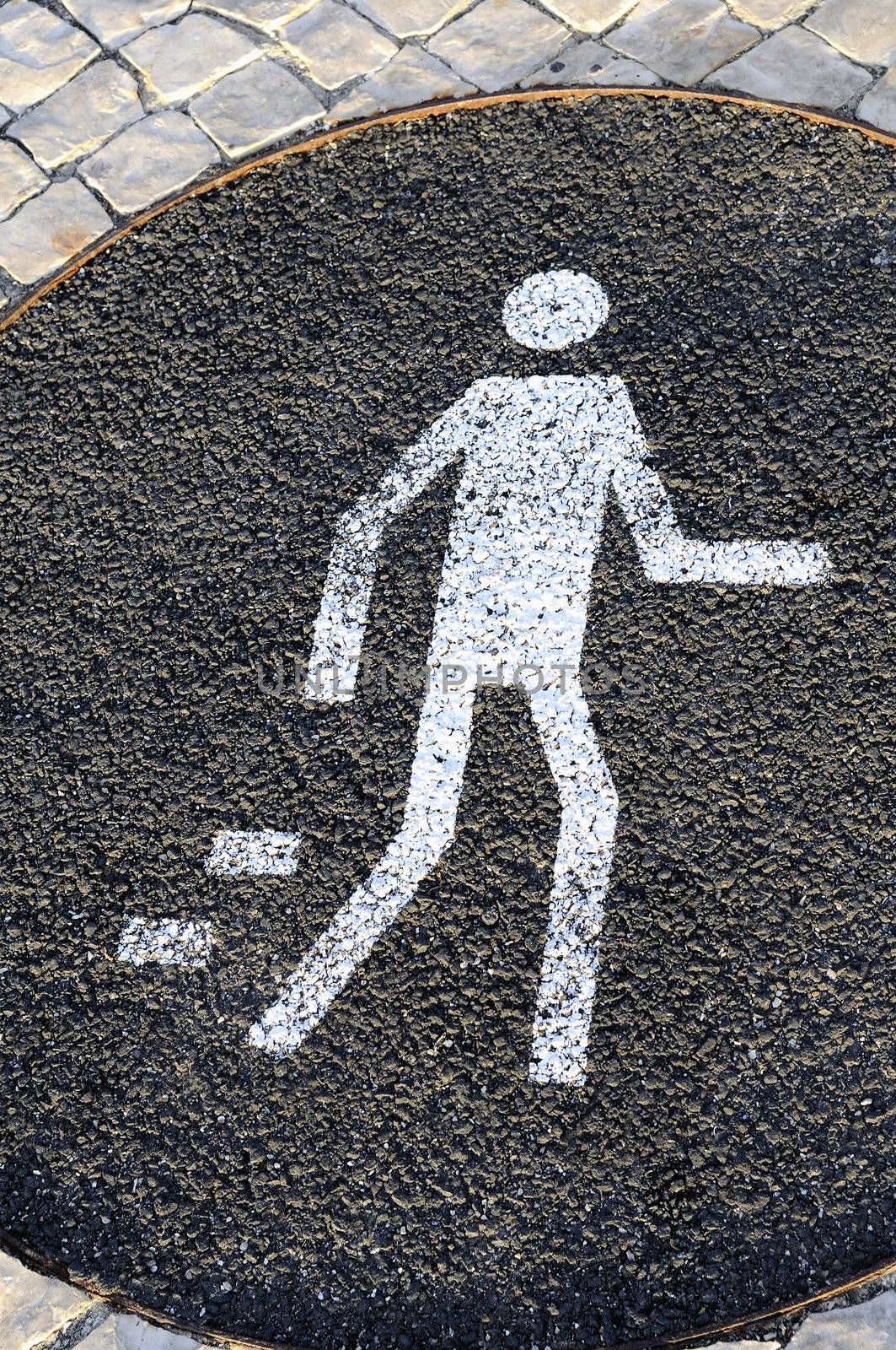 White pedestrian sign on the street, warning message