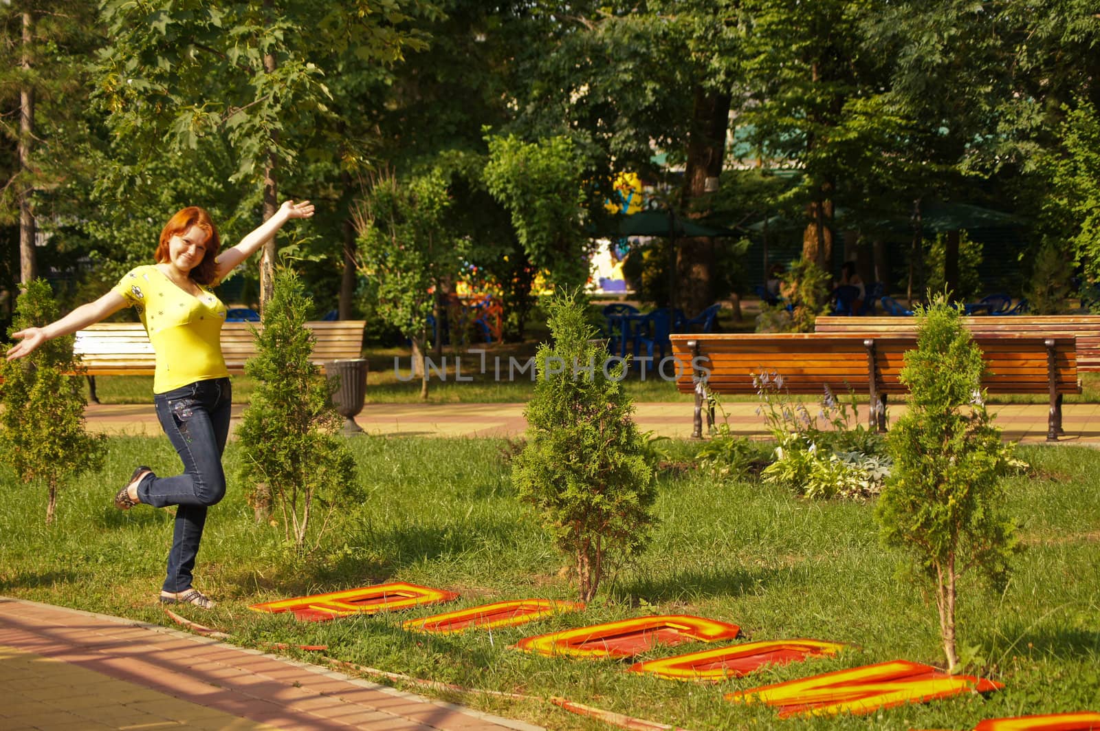 The young cheerful girl on walk