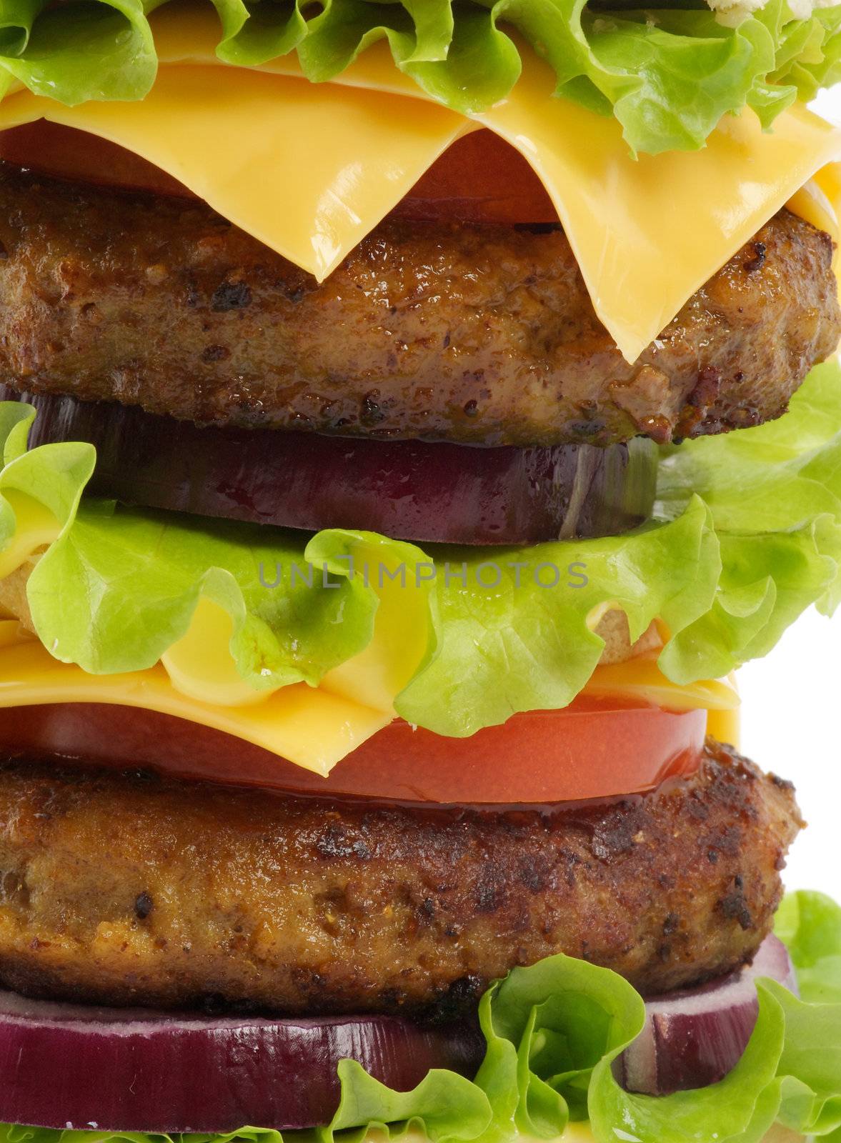 Tasty Double Cheeseburger with beef, tomato, letucce and cheese close up 