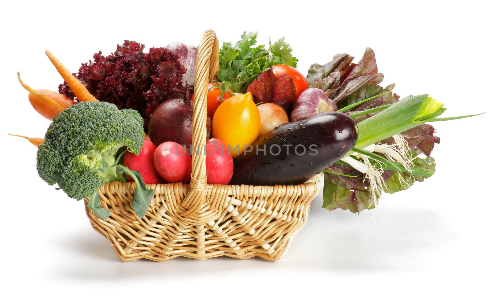 Basket of Various Vegetables with Broccoli, radishes, lettuce, onions, leeks, beets, carrots, red tomatoes, yellow tomatoes, parsley isolated on white background