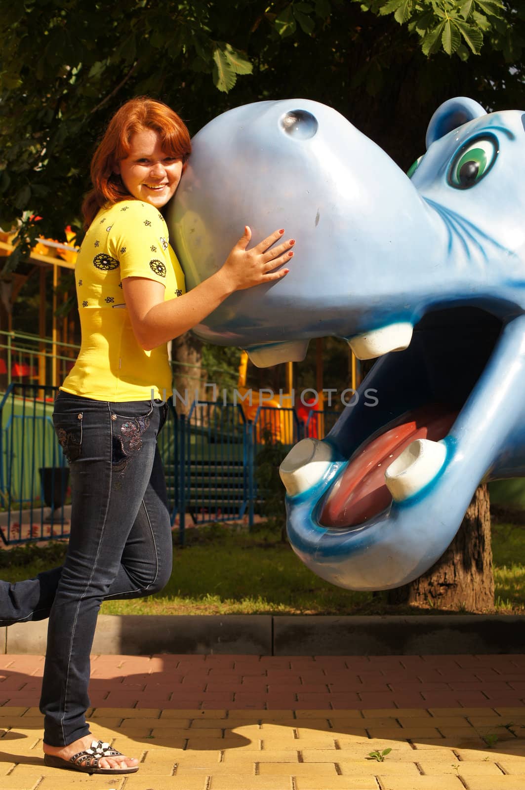 The young cheerful girl on walk