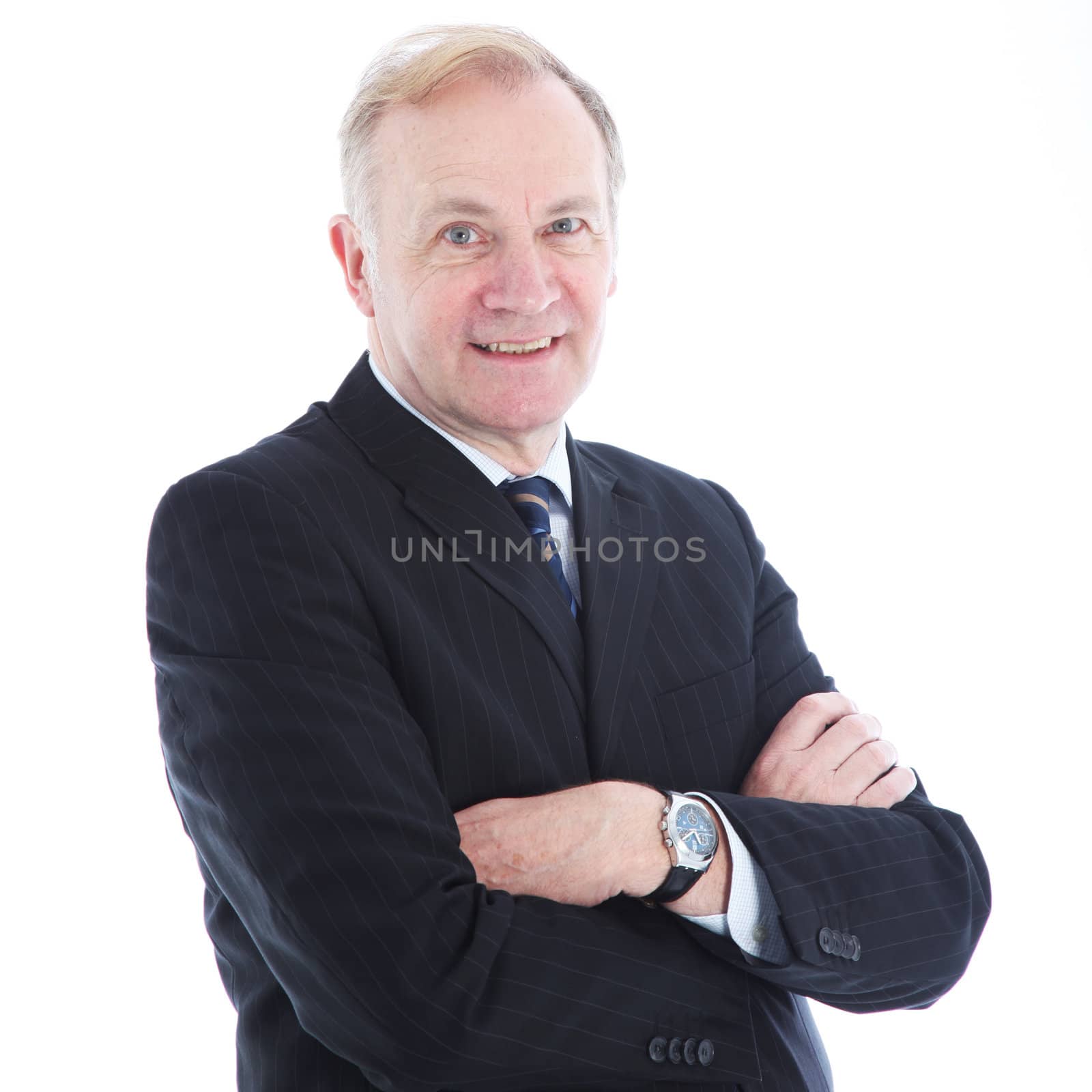 Smiling senior businessman with his arms folded across his chest isolated on white Smiling senior businessman with his arms folded across his chest isolated on white