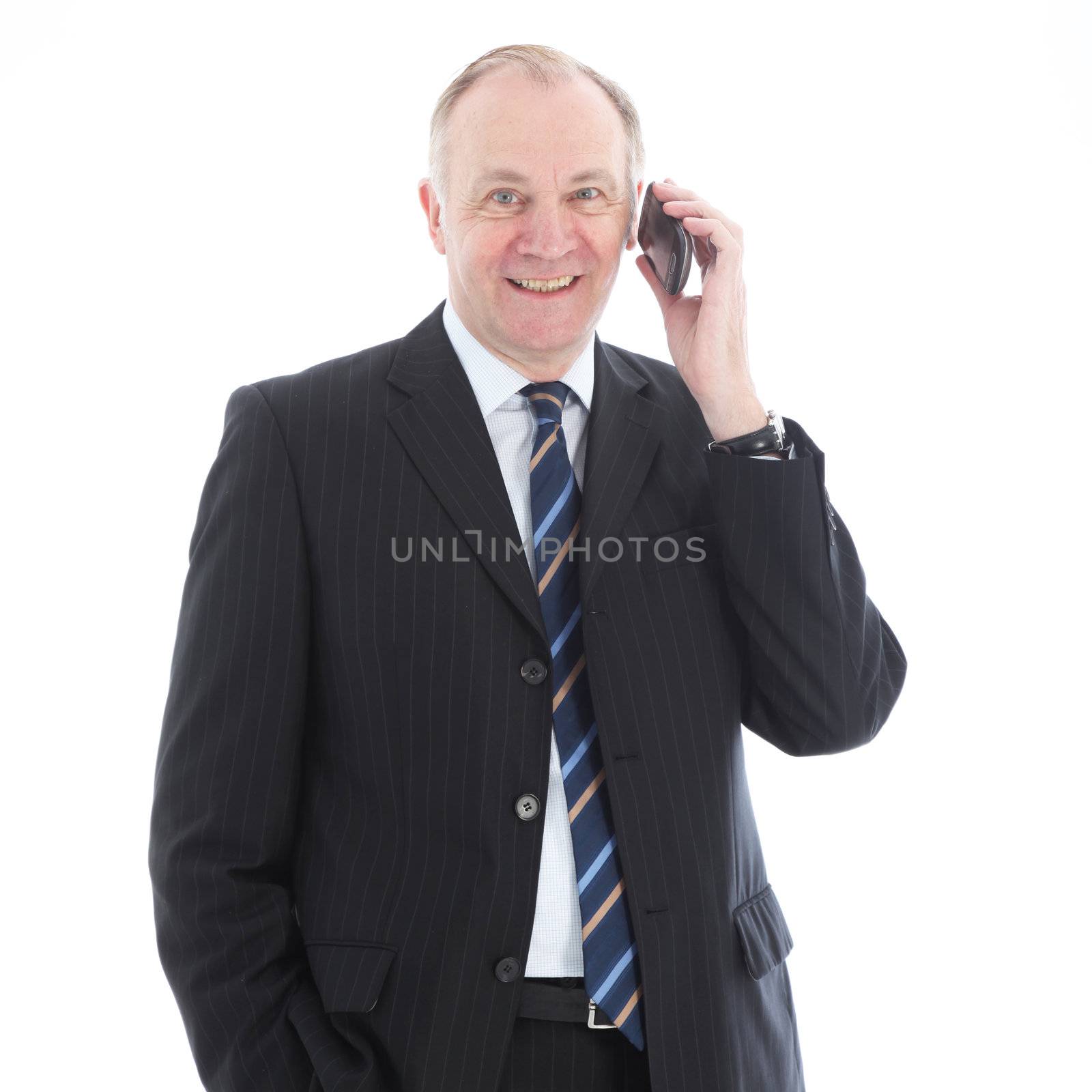 Happy friendly middle-aged businessman standing facing the camera using his mobile phone isolated on white Happy friendly businessman standing facing the camera using his mobile phone isolated on white 