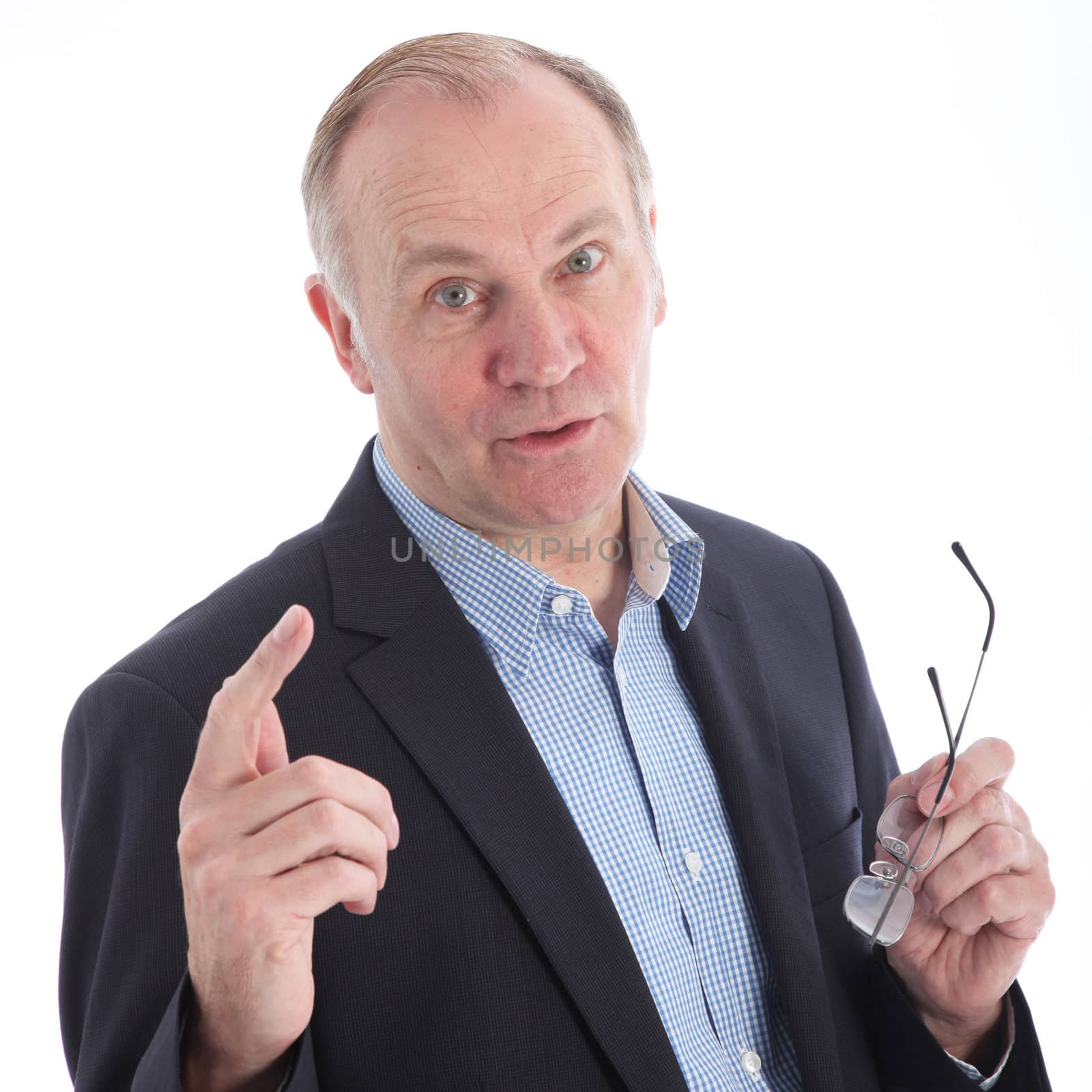 Persuasive businessman raising his finger to emphasise his point in discussion with the camera 