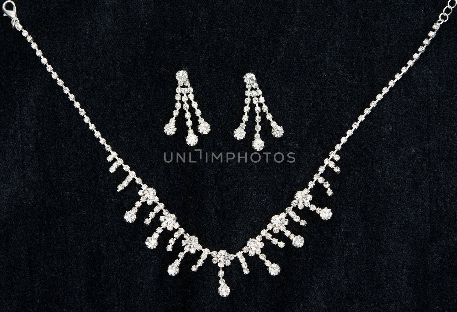 Necklace with sparkling stones on dark fabric