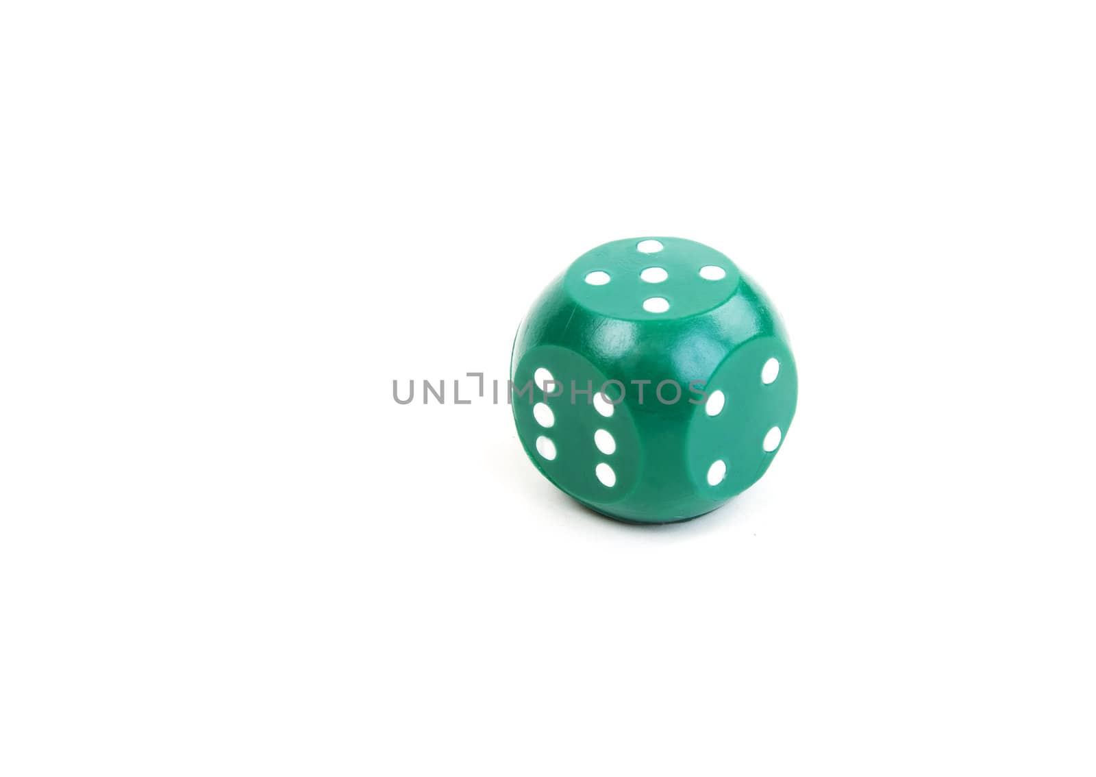 Green plastic dice on a white background